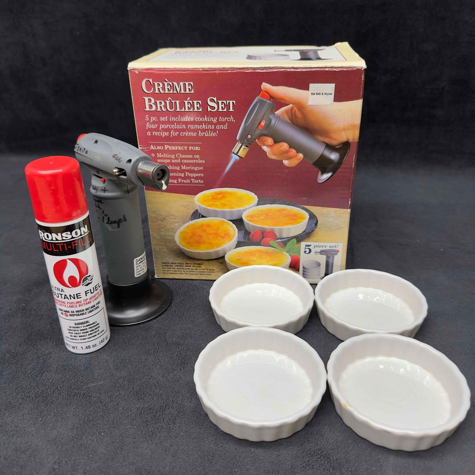 Bon Jour Creme Brulee Set Four White Ramekins and Cooking Torch Cheese Meringue: Bon Jour Creme Brulee Set Four White Ramekins and Cooking Torch Cheese Meringue. Includes butane refill, torch, and four (4) ramekins. This item is in good pre-owned, previously displayed condition