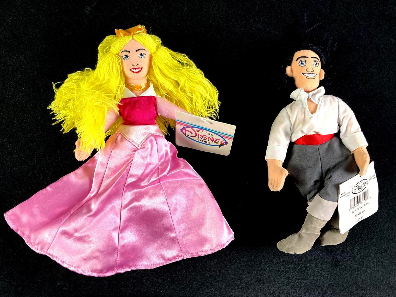 Set of (2) Disney Plush Bean Bag Dolls Eric and Princess Aurora: A set of (2) Disney bean bag plush dolls in particular Eric from the Disney classic The Little Mermaid and Princess Aurora from the film Sleeping Beauty. These dolls came from a twenty year collection