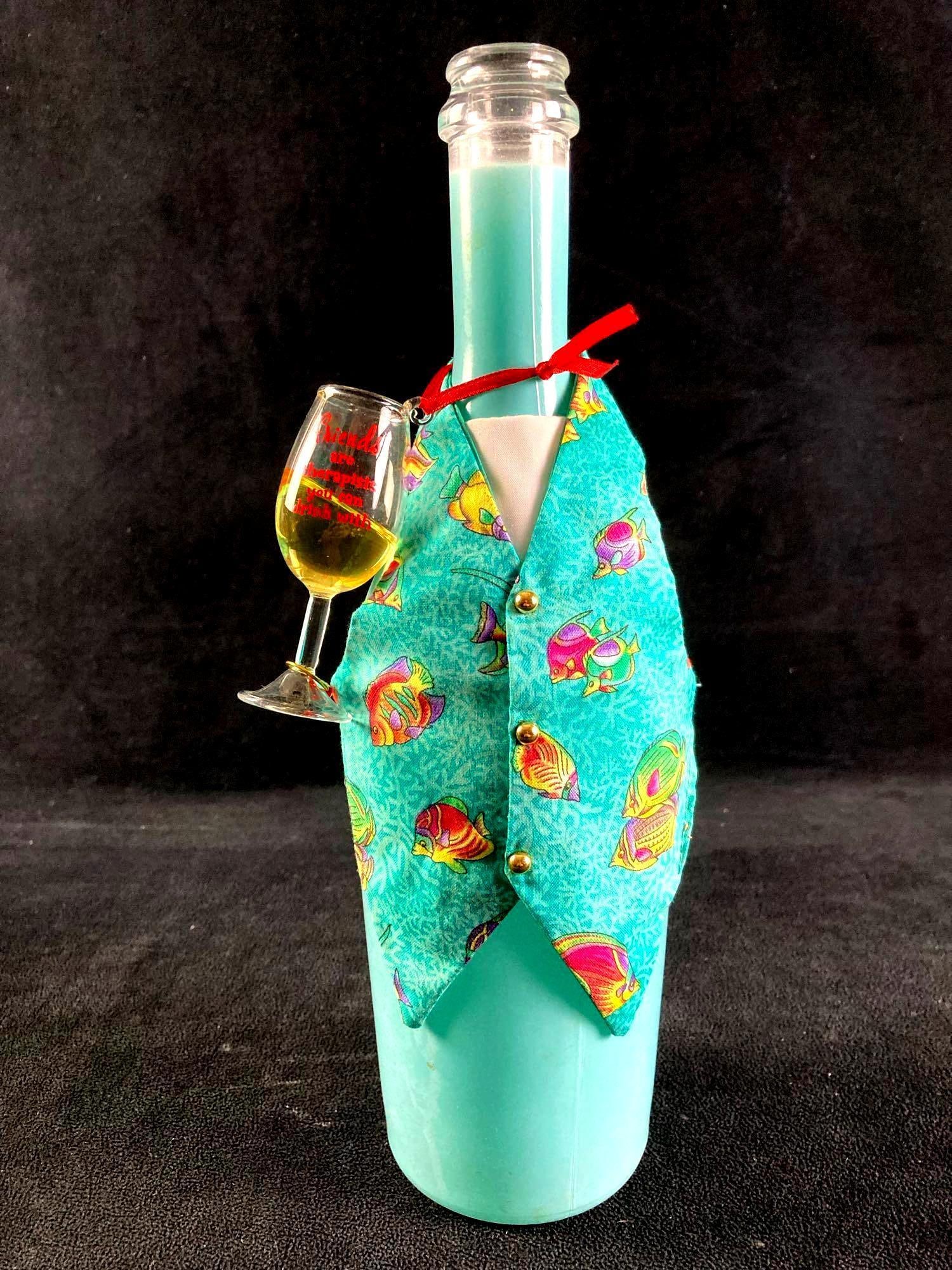 Tropical Wine Bottle with Vest and Small Wine Glass: This lot includes: (1) Wine Bottle w/ Vest and Small Wine Glass The condition is used and see photographs for additional details. The wine bottle has a small tropical vest along the front and