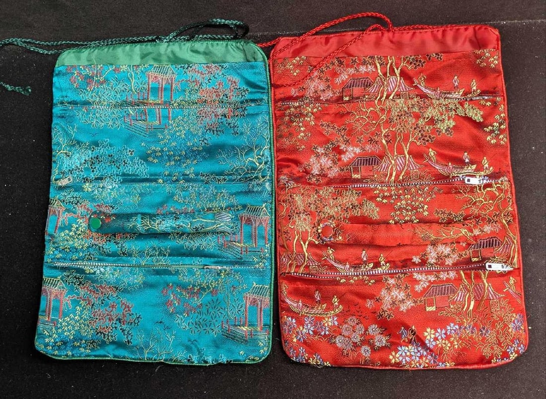 2 Vintage Teal And Red Asian Style Travel Jewelry Bags: 2 Vintage Teal And Red Asian Style Travel Jewelry Bags. Made to look like silk, these polyester bags are approx 8" x 1/8" x 11". Folded, these are 8" x 1/2" x5 3/4". The total weight is 0.24lb. Each b