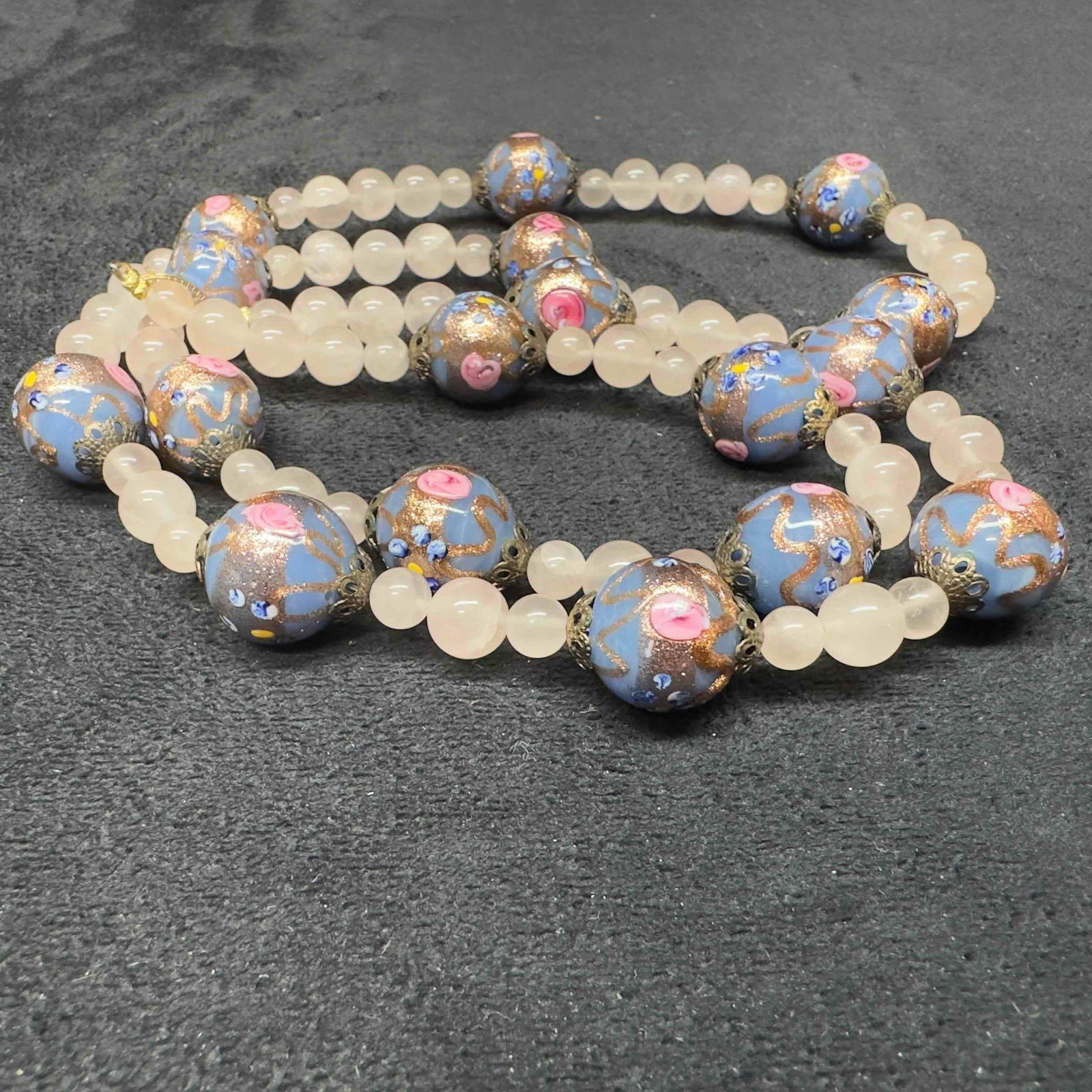 Venetian Murano Lamp Work Art Glass Floral Blue Bead Clear Beaded Accents Long Necklace B92: Venetian Murano Lamp Work Art Glass Floral Blue Bead Clear Beaded Accents Long Necklace B92. Necklace with blue colored glass beads with beautiful hand painted designs on each. The necklace features c