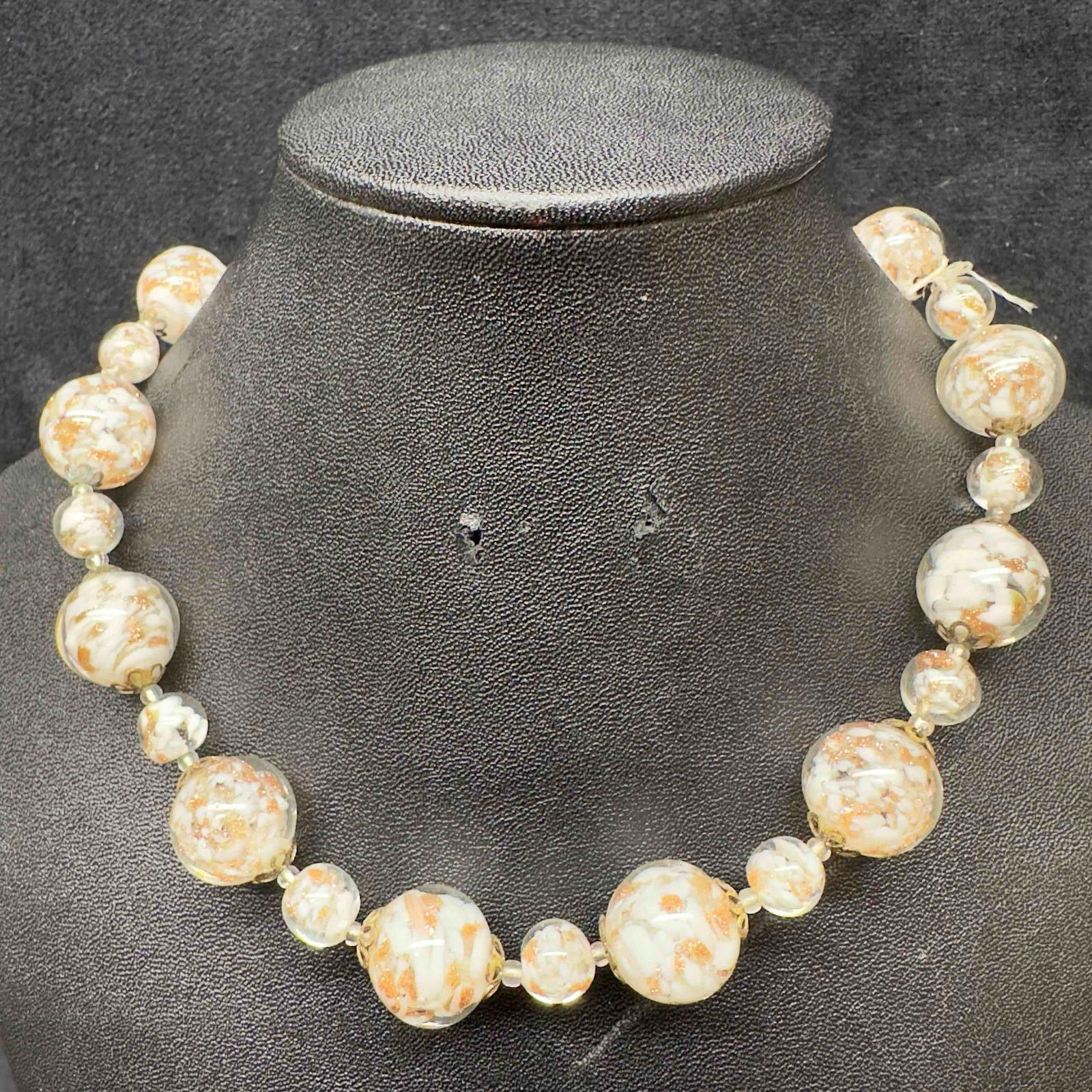 Venetian Murano Art Glass Lamp Work Clear Beaded White and Copper Accents Necklace D97: Venetian Murano Art Glass Lamp Work Clear Beaded White and Copper Accents Necklace D97. Necklace with white colored glass beads with beautiful designs on each. The necklace features copper colored acc