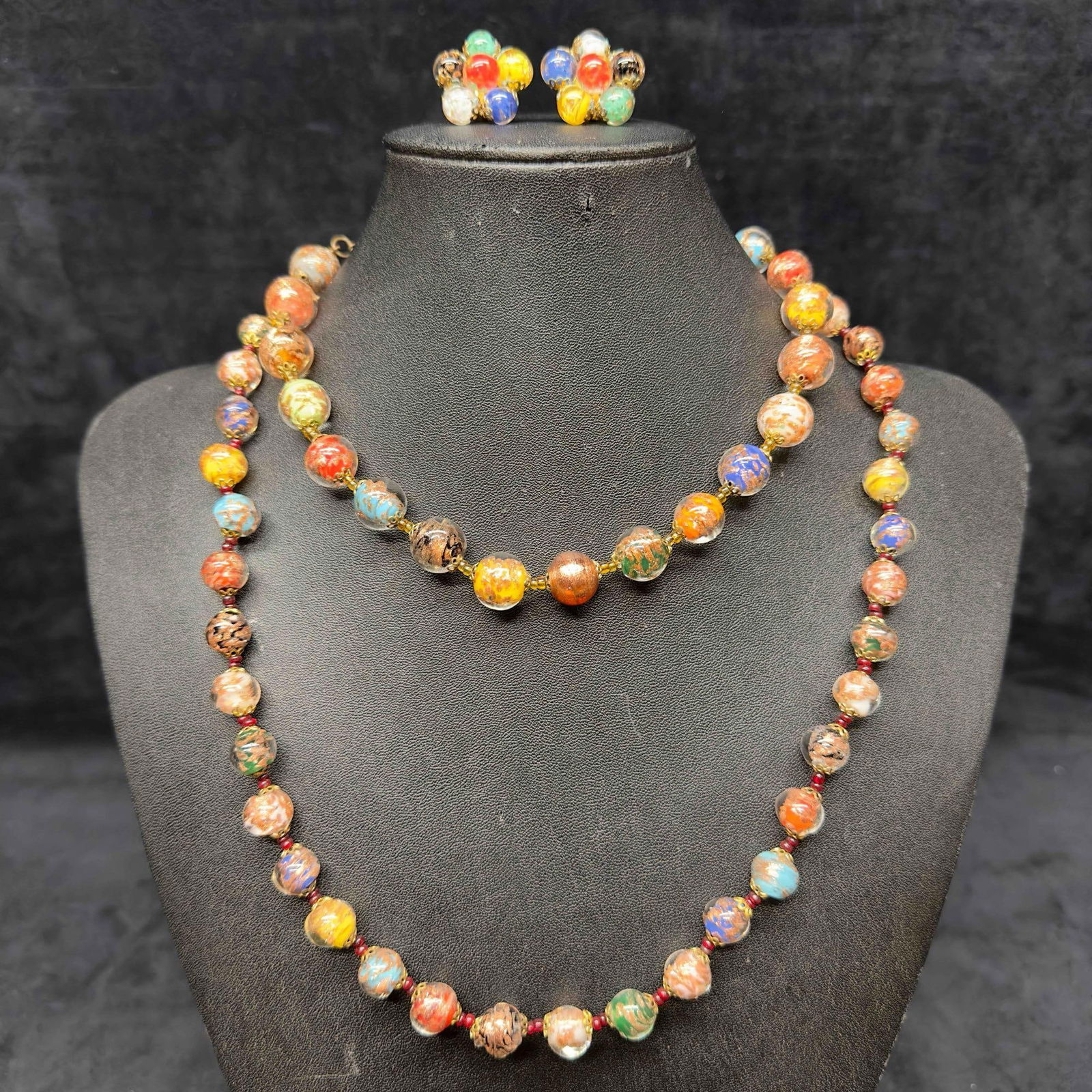 Murano Venetian Lamp Work Glass Multi Colored Round Bead Necklaces Copper Accent Earrings Set A43: Murano Venetian Lamp Work Glass Multi Colored Round Bead Necklaces Copper Accent Earrings Set A43. Necklaces and earrings with multi colored glass beads with beautiful designs on each. The necklaces