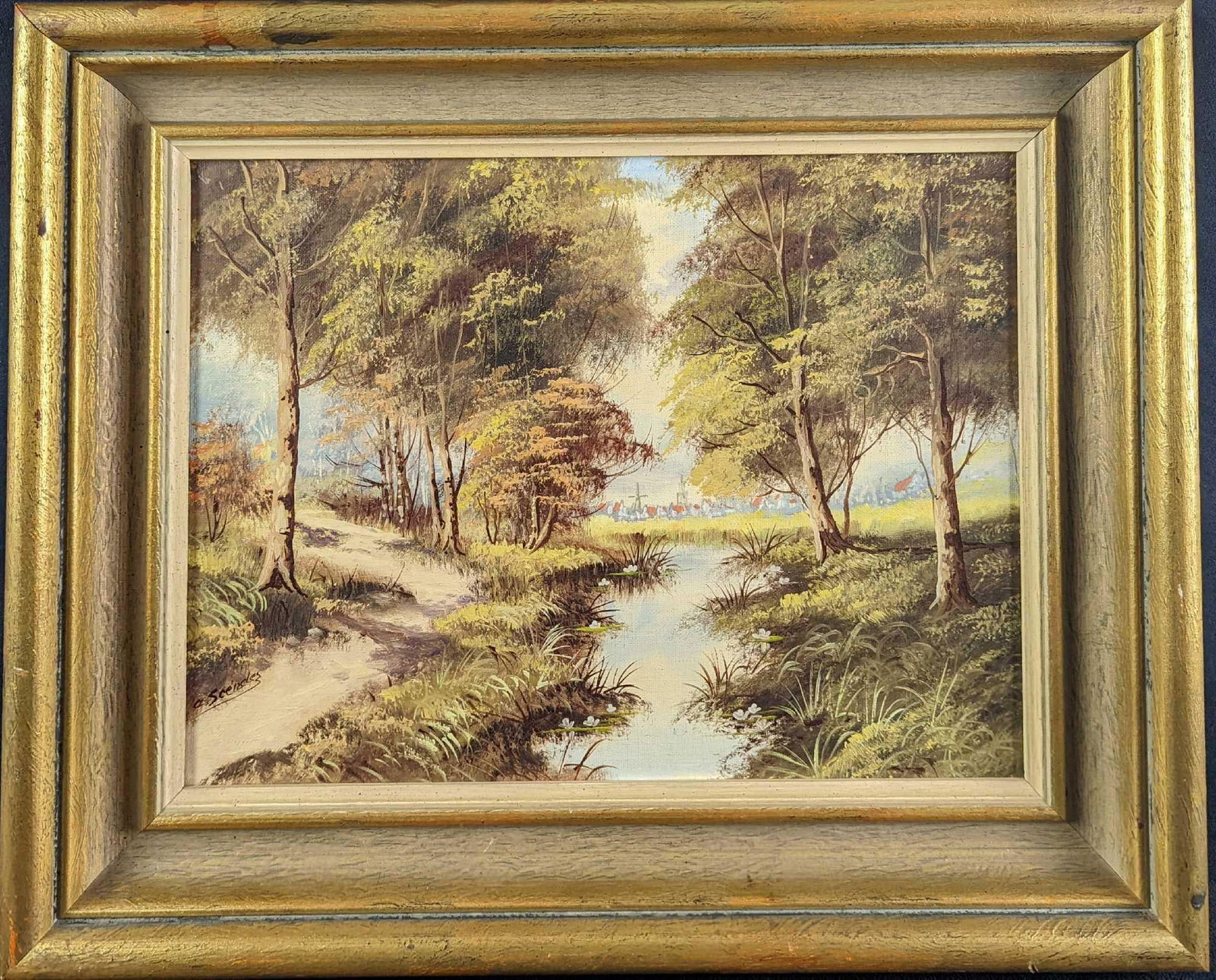 JB Framed Original Acrylic Village & Forest River: Here is an original acrylic on canvas that shows a little village at the end of a forest along with a little river. The original is signed by the artist on the bottom left. The framed original is appr