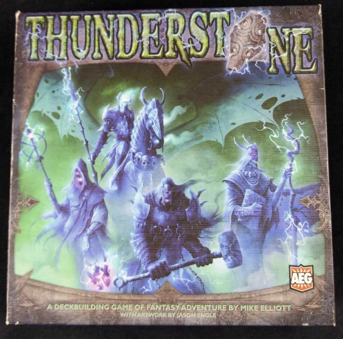 Thunderstone Fantasy Card Game In Box 2009: Thunderstone is a fantasy deck-building game much in the style of Dominion. Before the game starts a selection of Village and Hero cards will be randomly chosen that players may add to their specific