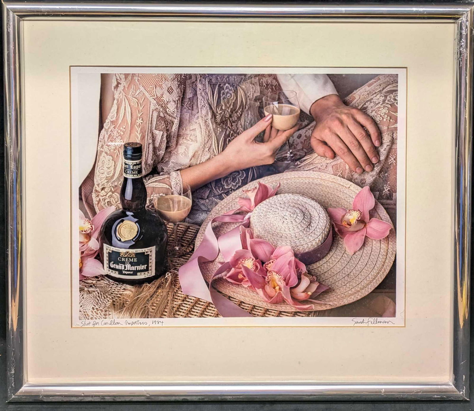 Signed Sandi Fellman Creme de Grand Marnier Cibachrome Print: Signed Sandi Fellman Creme de Grand Marnier Cibachrome Print. This is approx 28" x 1" x 24 1/2" and it weighs 8.70lbs. There is a small rip by the photo's title. The frame has markings and a dent on