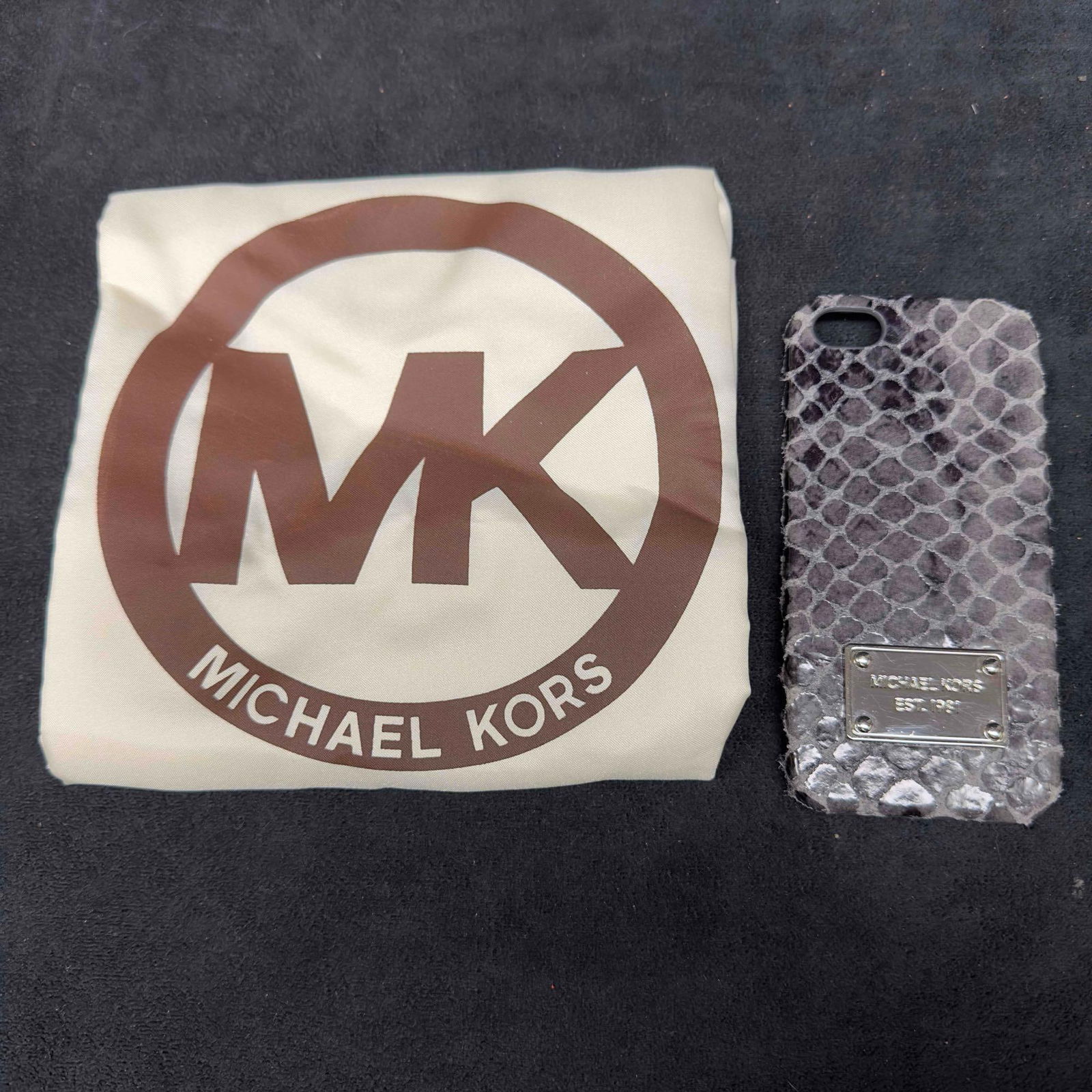 Michael Kors Snake Skin Python Black Gray Dark Slate Genuine Leather Cell Phone Cover Case: Michael Kors Snake Skin Python Black Gray Dark Slate Cell Phone Cover Case. Original tag included. Genuine leather. Including a Michael Kors white dust jacket bag. This item is in good like new,