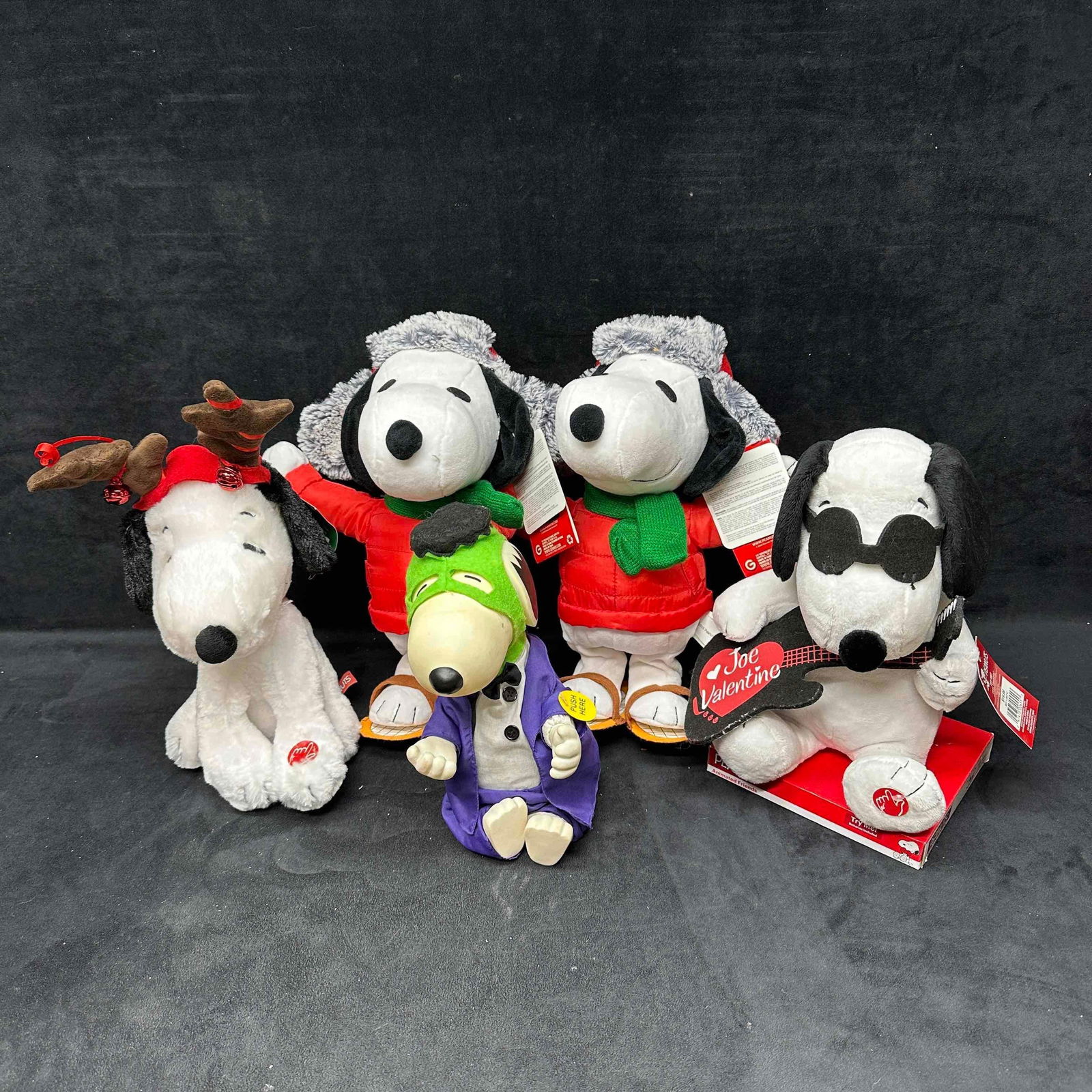 Charlie Brown Snoopy Holiday Animated Sound Plush Collection Gemmy: A festive collection of Snoopy plush toys, Halloween, Christmas, and Valentine's Day holidays represented. Some plush toys make noise, sound, and are animated. The Snoopy dressed as Frankenstein i