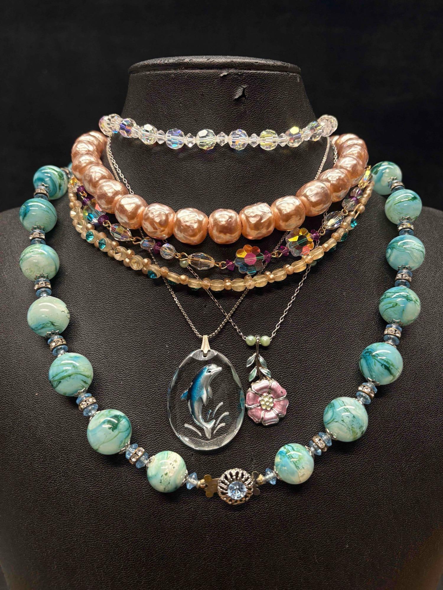 7pc Rainbow Suncatcher Inspired Necklace Lot: This lot consists of 7 pre-owned costume jewelry necklaces with typical wear from use. Please review images for context of the lots visual conditions. APPROX. WEIGHT: 7.7 OZ