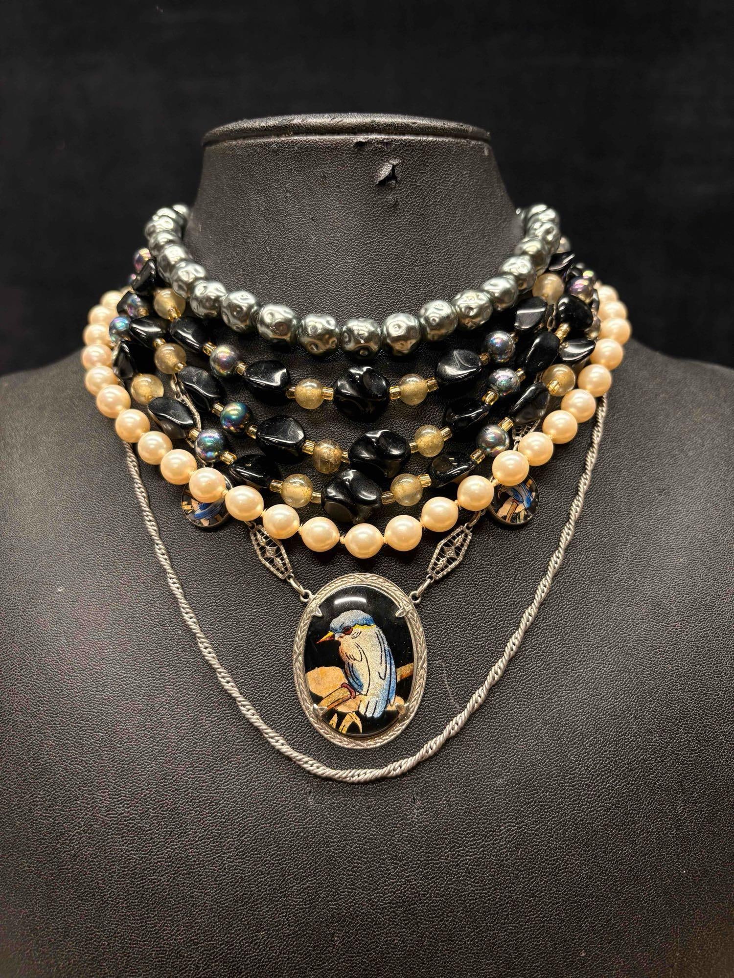 5pc Art Deco Kingfisher Necklace Lot: This lot consists of 5 pre-owned costume jewelry necklaces with typical wear from use. Please review images for context of the lots visual conditions. APPROX. WEIGHT: 5.8 OZ