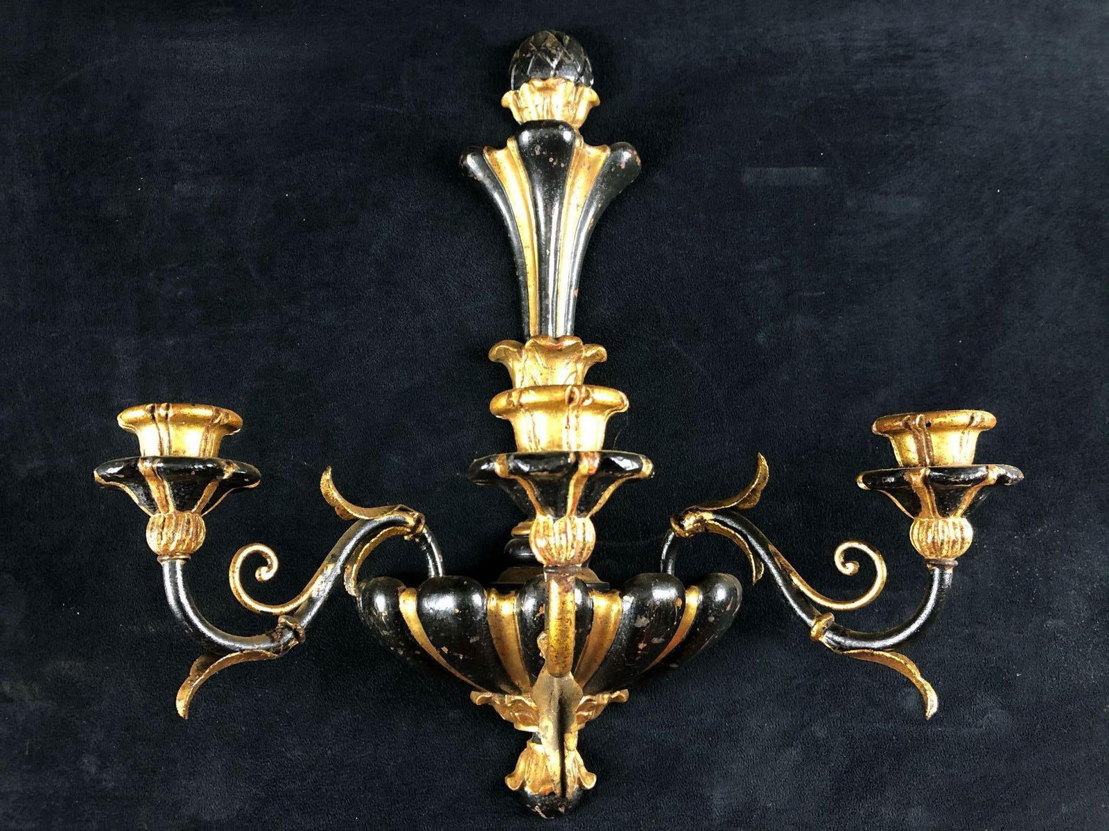 Beautiful Midcentury Hollywood Regency Italian Gothic Wood & Metal Gilded Candelabra Wall Sconce: This is a beautiful Midcentury Hollywood Regency Italian metal and wood candelabra with three arms and three wood candle holders. This stunning black & gold gilded piece is in very