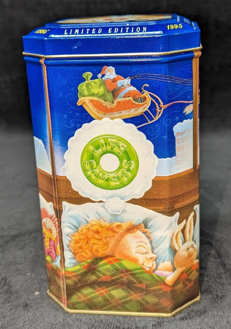 Limited Edition 1995 Christmas Life Savers Tin: Limited Edition 1995 Christmas Life Savers Tin. This is approx 4" x 4" x 7 1/4" and it weighs 0.39lb. The tin is in a good, used condition with very light markings. 