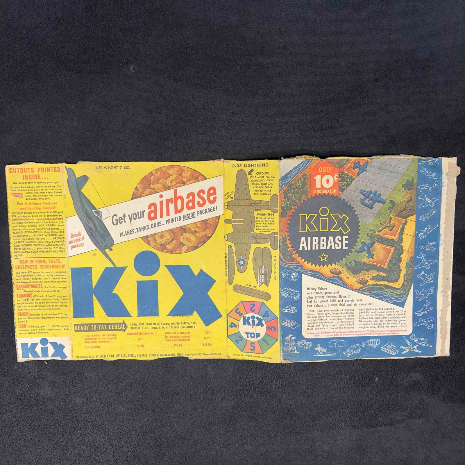 Kix Cereal Box Airbase Advertisement General Mills 1945: Kix Cereal Box Airbase Advertisement General Mills 1945. This cereal box advertisement features Kix with a cutout Airbase. This paper collectible shows wear with some fold creases. This item is in goo