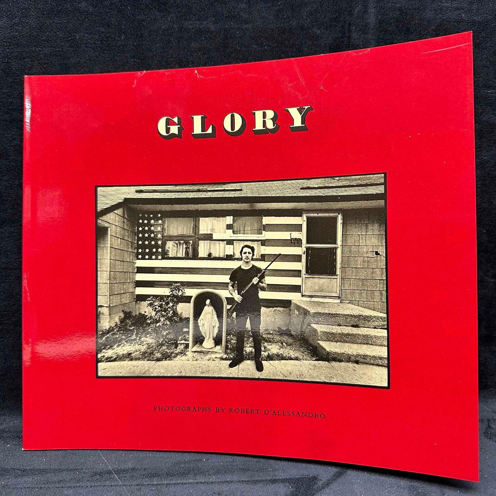Glory by Robert D’Alessandro Signed 1973 Americana Photography Book: Softcover book featuring black-and-white photographs by Robert D’Alessandro, published by Elephant Publishing Corporation, New York City, 1972. This copy is signed by the photographer on the title p