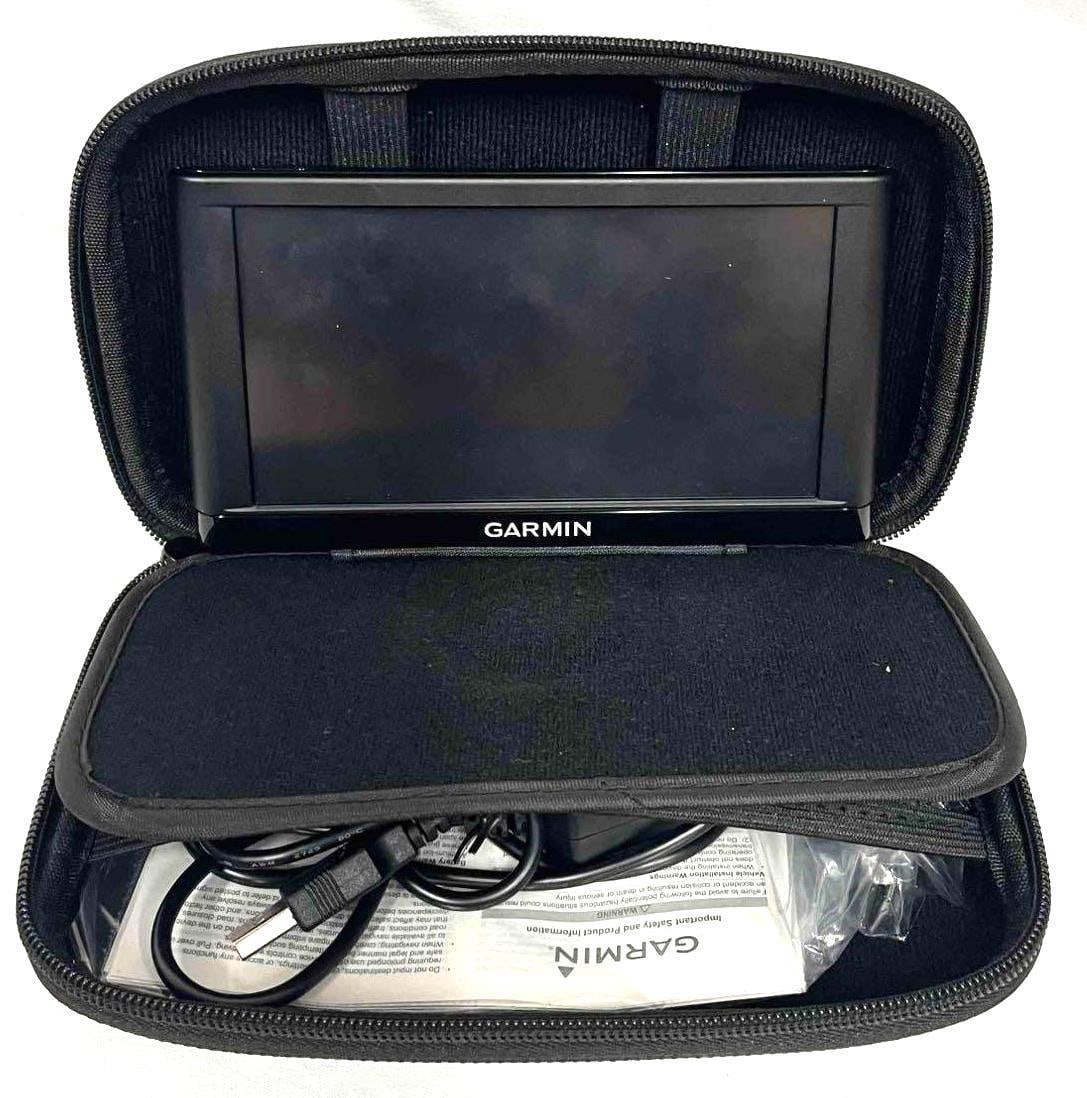 Garmin Portable Navigation Car GPS: This lot contains a Garmin Portable Navigation Car GPS. The case is approx 8" x 5" x 2 1/4" and it weighs about 1.1lbs. Overall the Garmin was in good used condition with some light wear from use