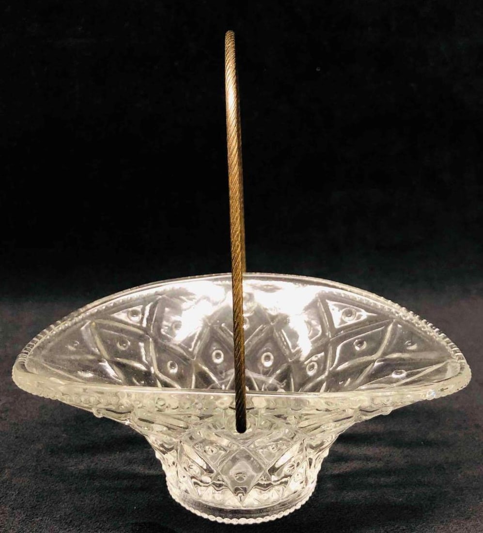 Avon Glass Basket With Gold Tone Rope: This lot contains Avon Glass Basket With Gold Tone Rope. It is approx 4" x 5 3/4" x 6" and it weighs about 0.4lbs. Overall the Avon glass basket is in good used condition with some light wear from