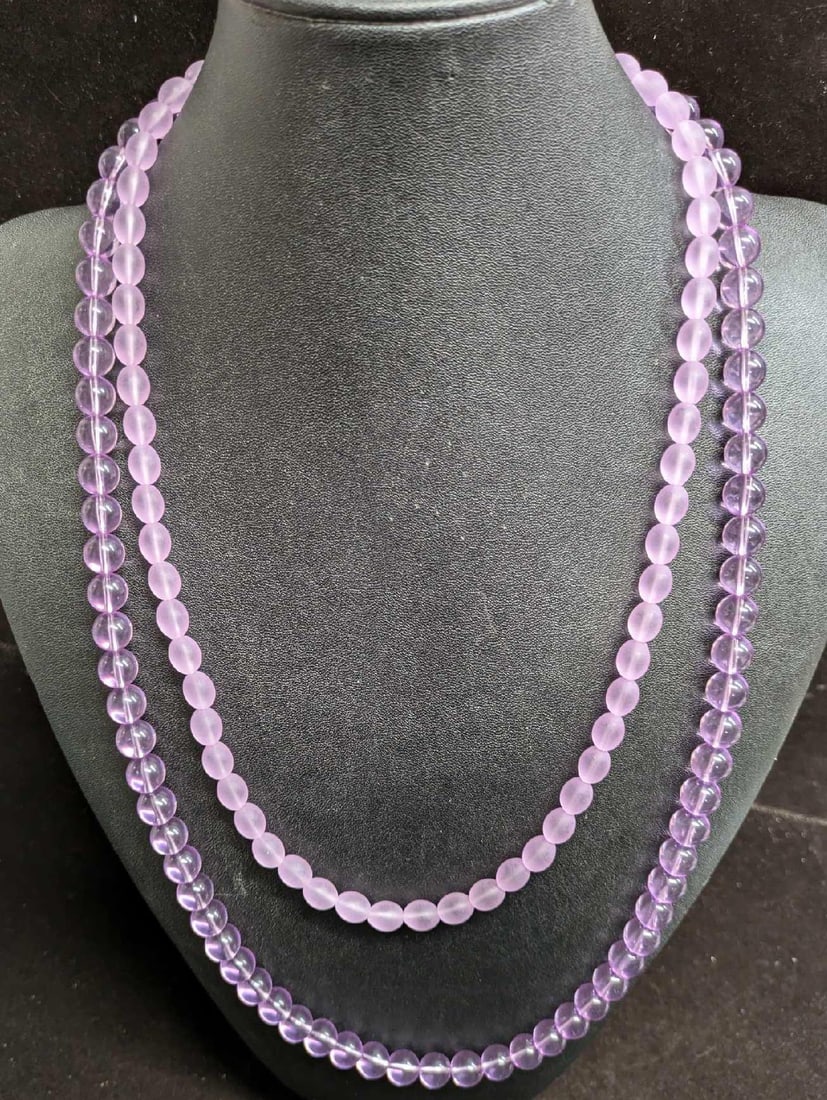 2 Acrylic Unmarked Purple Necklaces: 2 Acrylic Unmarked Purple Necklaces. The clear beads are approx 29". The other is approx 23". Both come in a bag that is approx 5" x 1/2" x 5" and it weighs 0.14lb. 