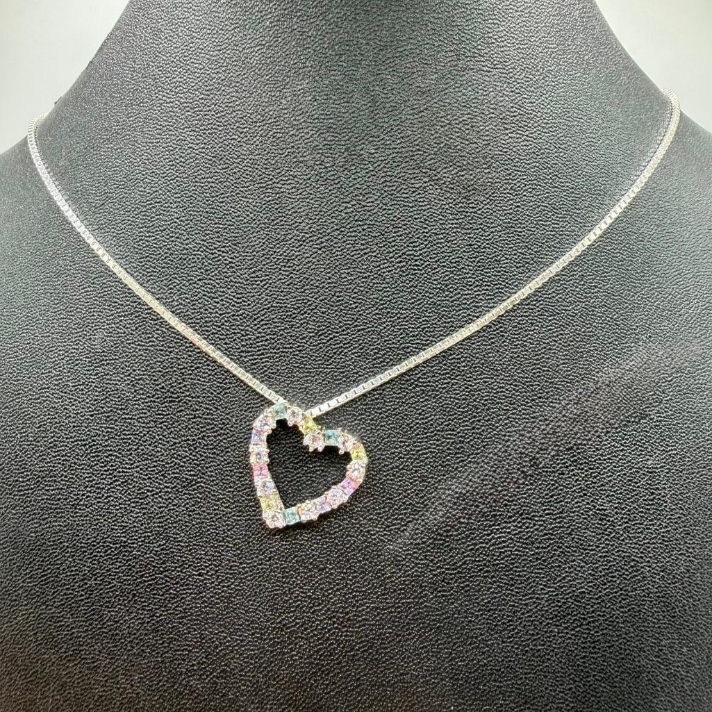 Sterling Silver Necklace With CZ Heart Pendant: This piece of jewelry has been tested and researched prior to listing. Please view all our pictures they are part of our description. DETAILS: Metal - Sterling SilverColor - SilverStones -
