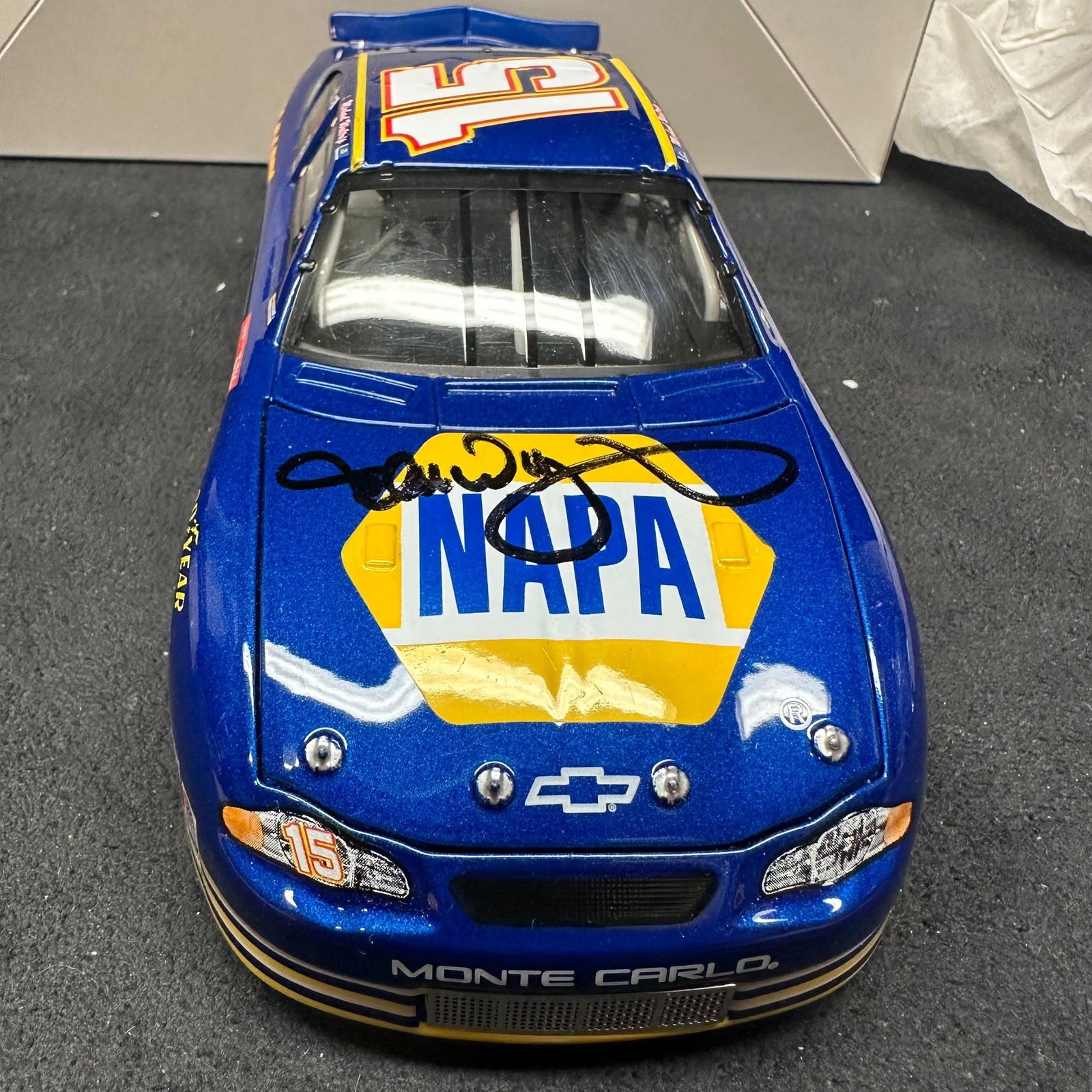 Signed Michael Waltrip NAPA Racing 2002 Monte Carlo 1:24 Diecast Stock Car: 1:24 scale NASCAR diecast stock car featuring the #15 NAPA Racing Chevrolet Monte Carlo driven by Michael Waltrip. Produced by Action Racing Collectibles for the 2002 season. Hand-signed on the hood