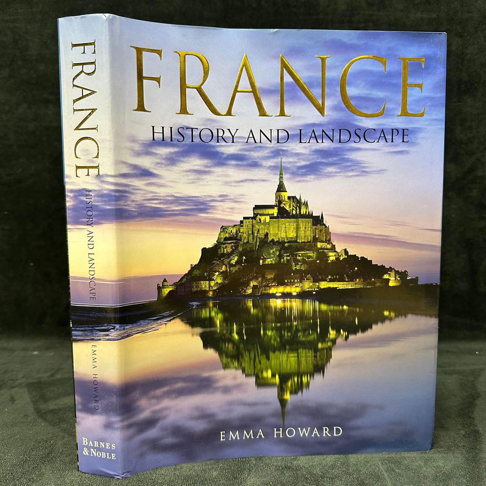 France History and Landscape by Emma Howard Illustrated Hardcover Book: Hardcover coffee table book titled France: History and Landscape by Emma Howard, published by Barnes & Noble. Features full-color photography and written overviews of France’s regions,