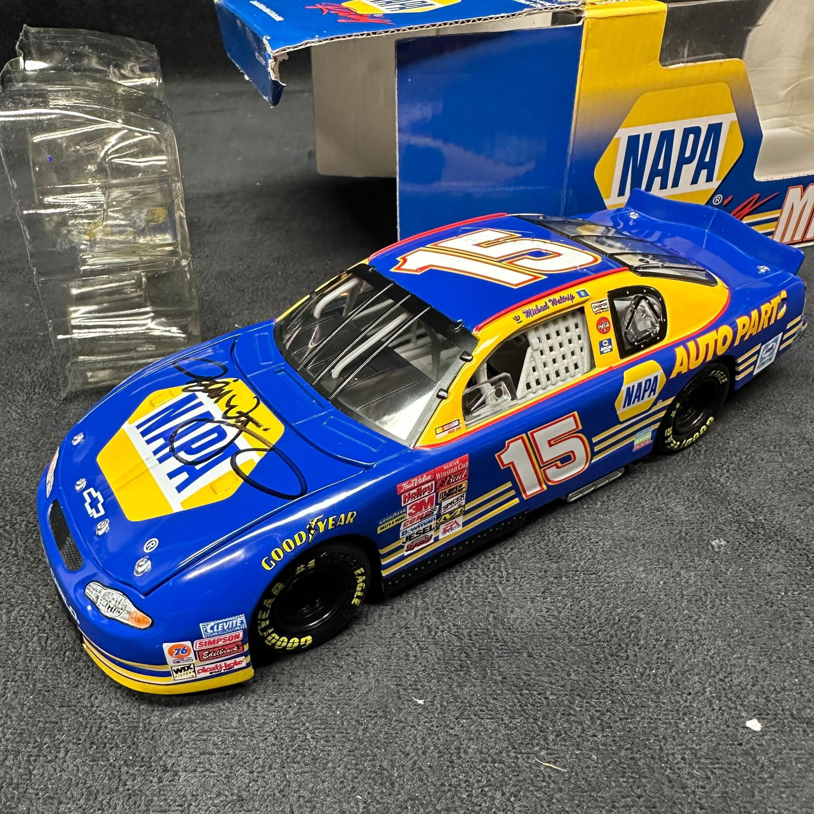 Michael Waltrip Signed NAPA Racing Chevrolet Monte Carlo 1:24 Diecast Daytona 500 Stock Car: Limited edition 1:24 scale NASCAR diecast featuring Michael Waltrip’s #15 NAPA Auto Parts Chevrolet Monte Carlo, commemorating his 2001 Daytona 500 win. The car is hand-signed on the hood by