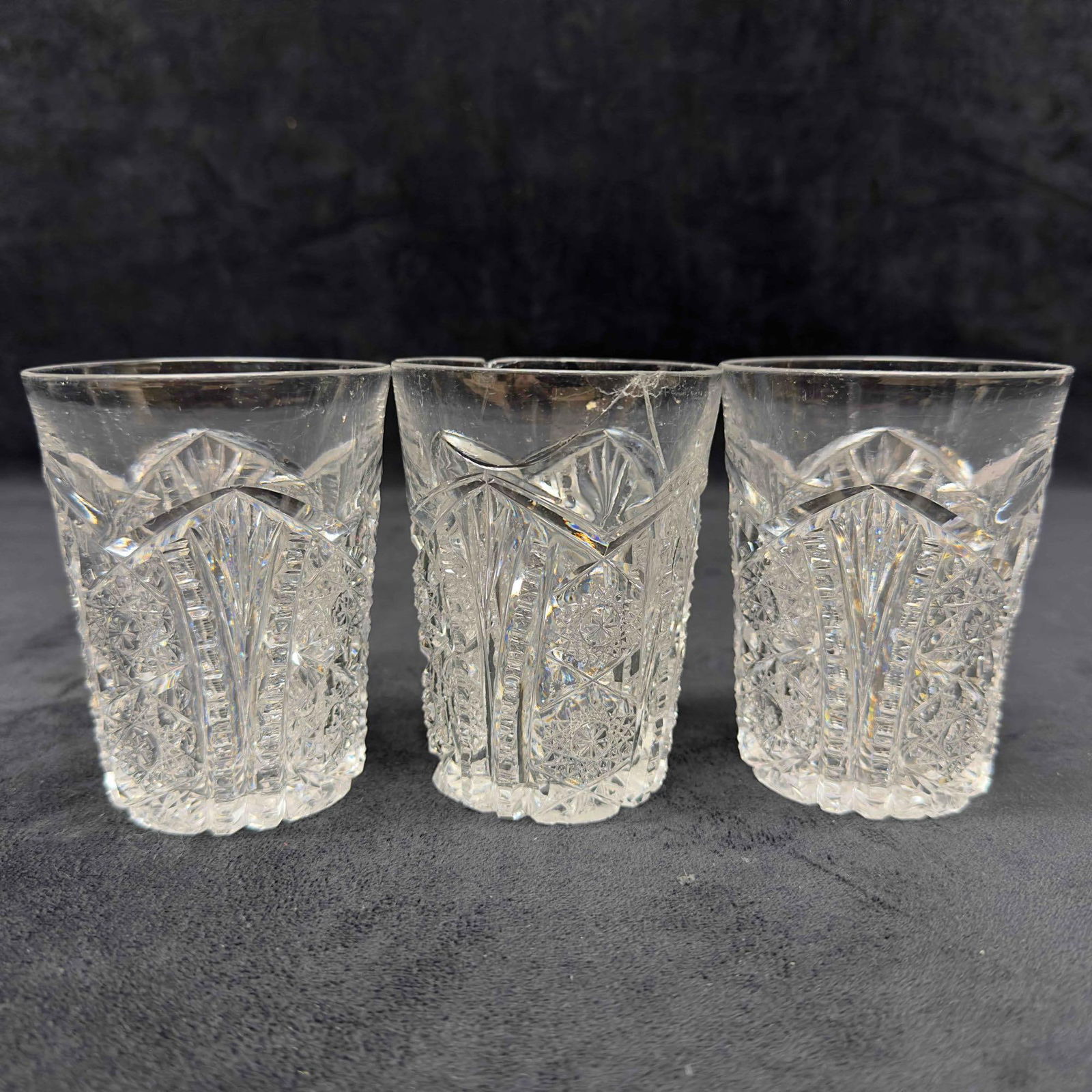 Imperial Daisy Clear Pressed Cut Crystal Glass Three Glasses Set: Imperial Daisy Clear Pressed Cut Crystal Glass Three Glasses Set. Crystal etched glass art cup set of three (3) glasses. Light chips and cracks along the edges of one glass, one has a noticeable