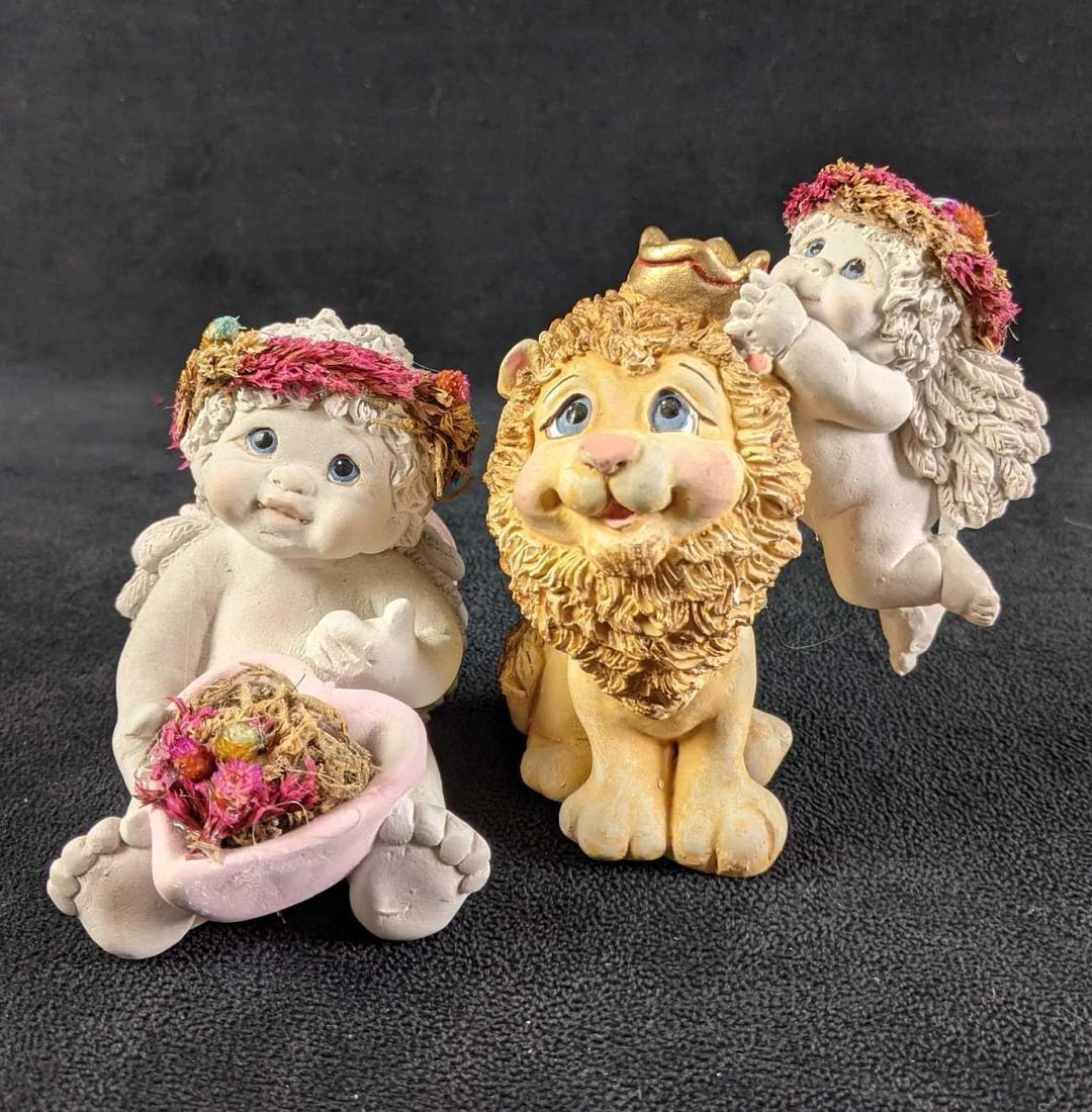 Two Dreamsicles Figurines Lion and baby (1) "Hearts and Flowers" (2) "King of the Jungle": Two Dreamsicles Figurines (1) "Hearts and Flowers" (2) "King of the Jungle" (1) "Hearts and Flowers" Baby Angel with a heart-shaped basket of flowers. Good condition Slight wea