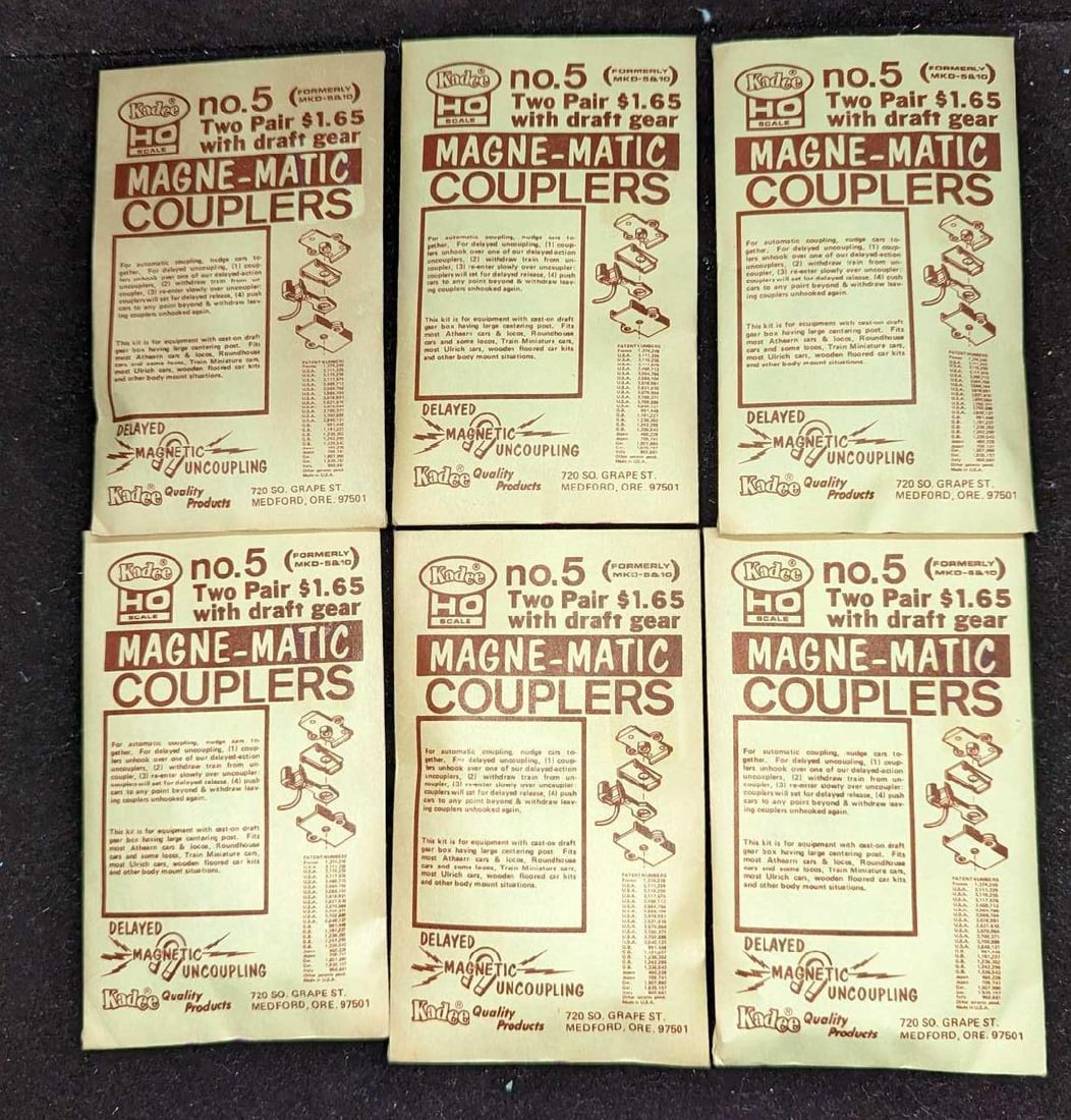 5 Sealed Packages OF Kadee No 5 Magne-Matic Couplers: 5 Sealed Packages OF Kadee No 5 Magne-Matic Couplers. Each is approx 2 7/8" x 5" and the total weight is 0.09lb. Each comes with two pairs and draft gear. 