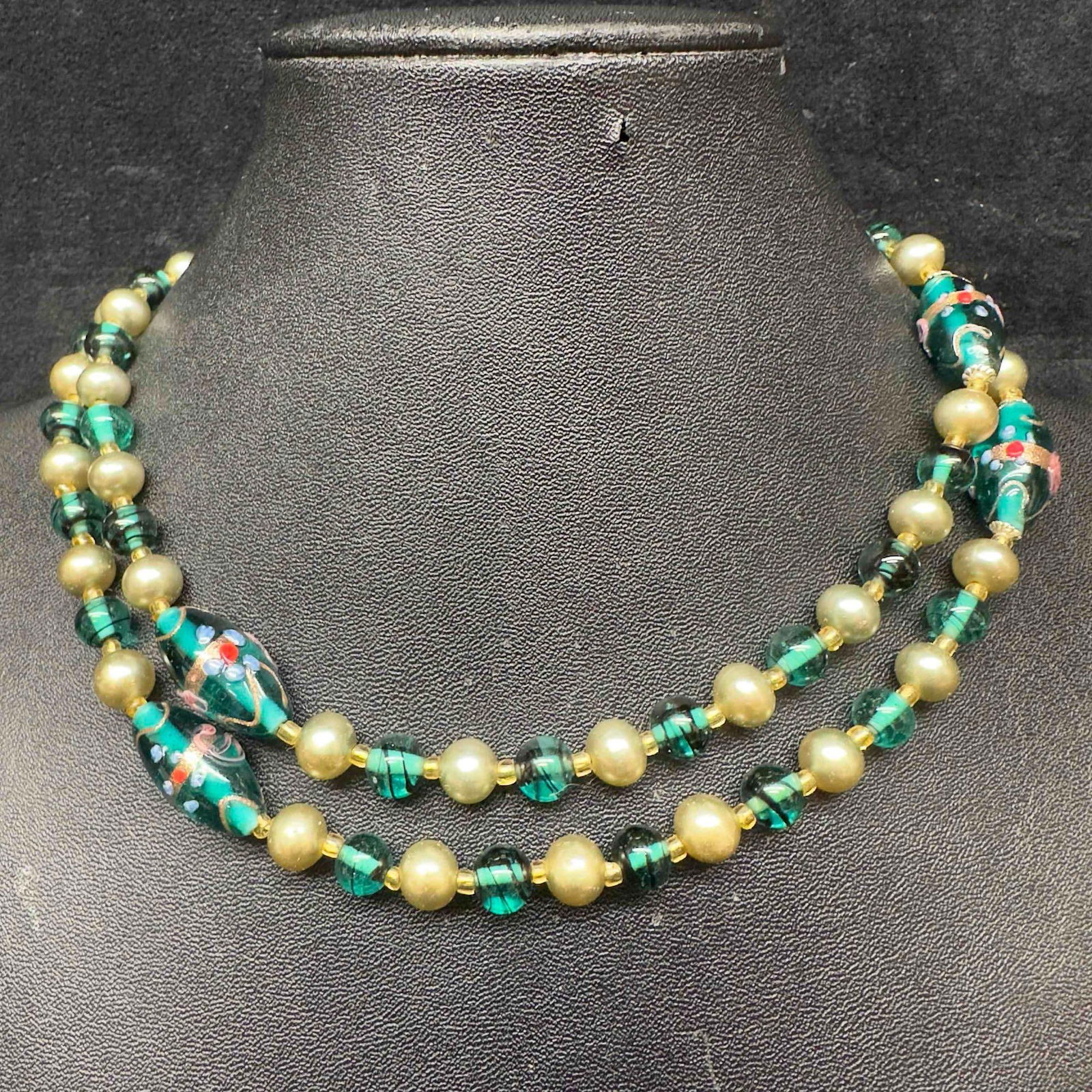 Venetian Murano Lamp Work Art Glass Green Floral Pearl Colored Accents Bead Long Necklace F76: Venetian Murano Lamp Work Art Glass Green Floral Pearl Colored Accents Bead Long Necklace F76. Necklace with green colored glass beads with beautiful designs on each. The necklace features pearl and c