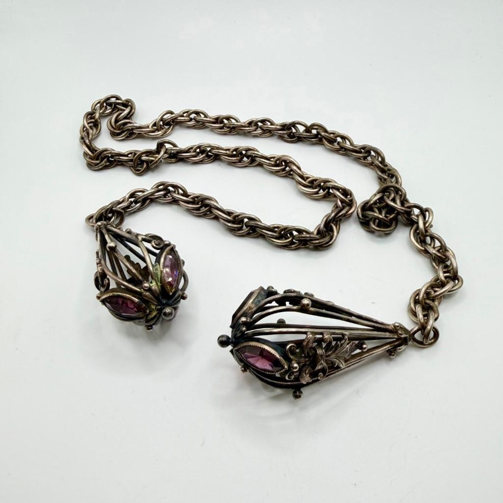 Antique Silver-Plated Curtain Tieback: Antique Silver-Plated Curtain Tieback Antique curtain tieback with chain and two decorative ends with filigree design and purple stones. In good condition with tarnish from age. Approximate size: 29