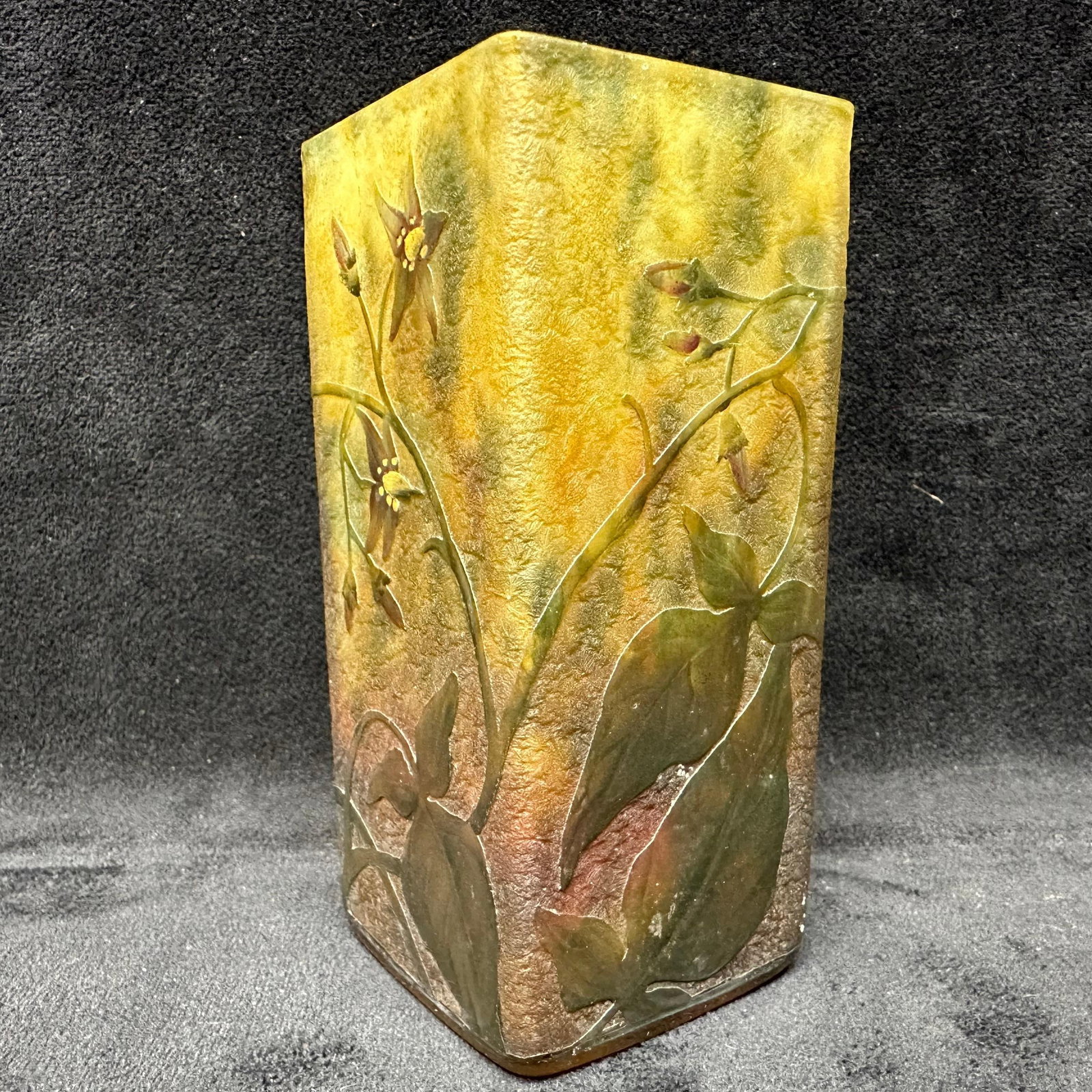 Jean Daum French Art Nouveau Glass Cameo Vase with Floral Decoration: Small rectangular French art glass vase with softly mottled yellow, green, and amber ground, decorated with raised cameo floral and leaf motifs. Acid-etched and carved decoration with layered glass.