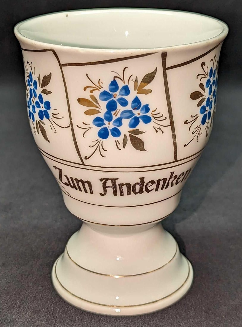 Vintage Porcelain German Memory Cup: Vintage Porcelain German Memory Cup. Has a saying on the side, "Zum Andenken", which roughly translated means, "In Memory". This cup is approx 3 1/4" x 3 1/4" x4 3/4" and it weighs 0.50lb. The c
