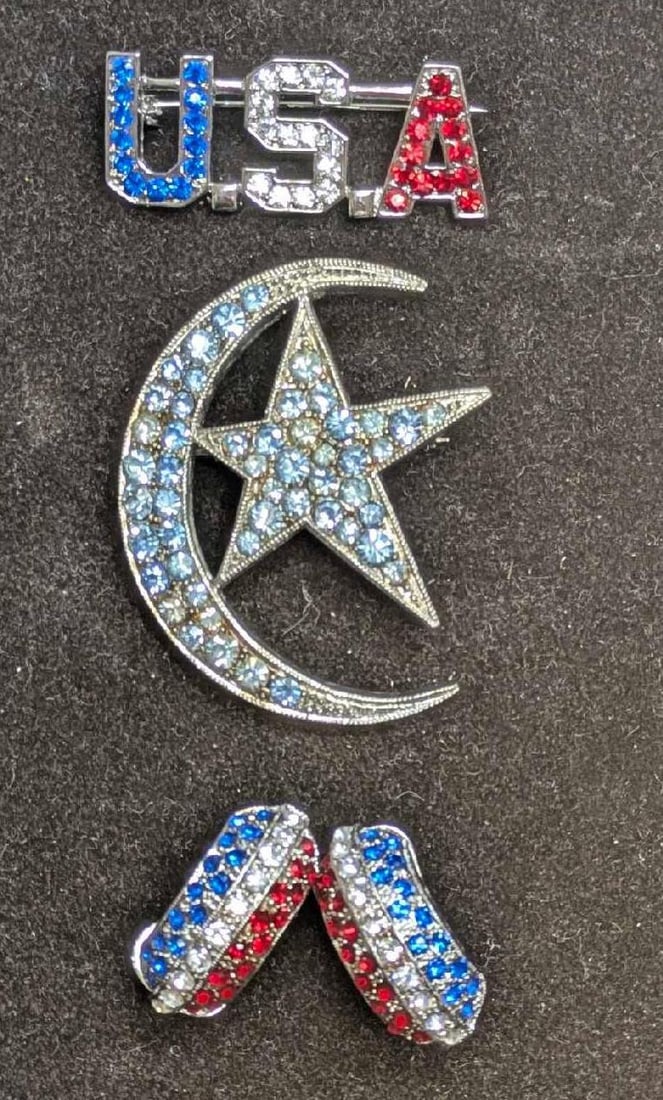 Vintage Red Clear Blue Rhinestone USA Moon And Star Earrings And Brooch Pins: Vintage Red Clear Blue Rhinestone USA Moon And Star Earrings And Brooch Pins. This lot includes: (1) Unmarked Set Of Clip On Red Clear Blue Rhinestone Earrings. Each is approx 1" x 3/8" x 1/2