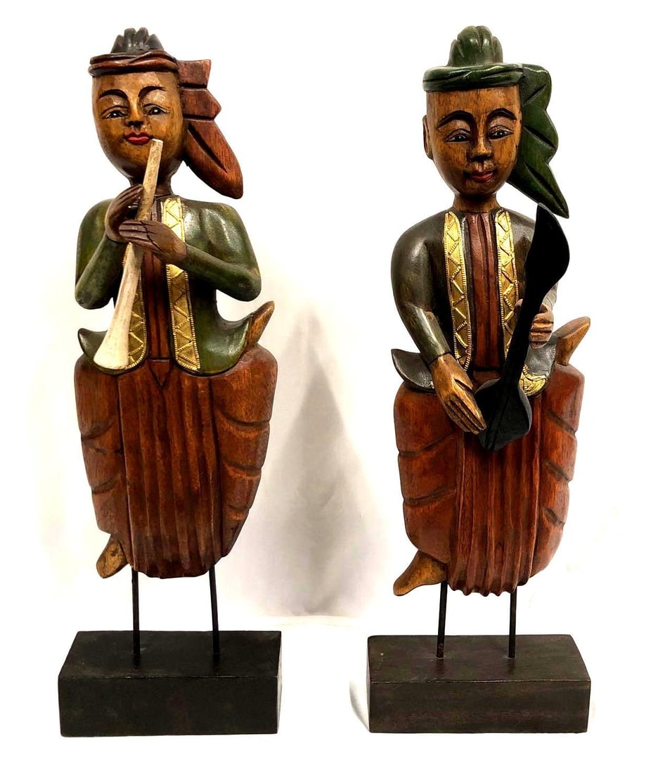 Pair of Vintage Carved Wood Thai Painted Musicians: Pair of Vintage Carved Wood Thai Painted Musicians. Each Wood Sculpture is approximately 21-1/2" x 6" x 7" with a combined weight of about 6.5lbs. Overall the Carved Wood Figures are in good used