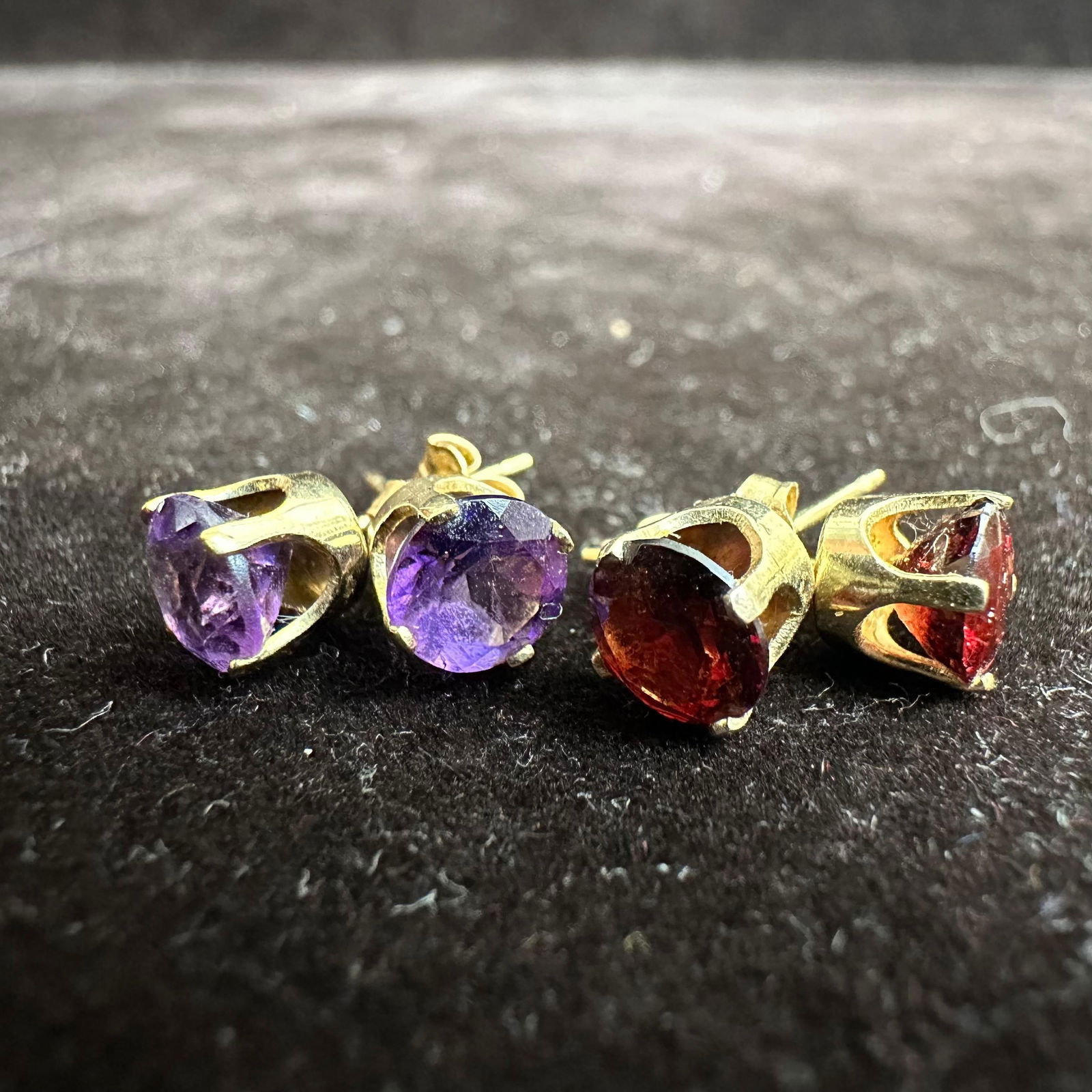 Pair 14K Yellow Gold Prong Red Garnet and Purple Amethyst Earrings: These items are in good pre-owned, previously used/displayed condition with noticeable light wear and surface scratches. Please reference all photos for full details. These pieces of jewelry have