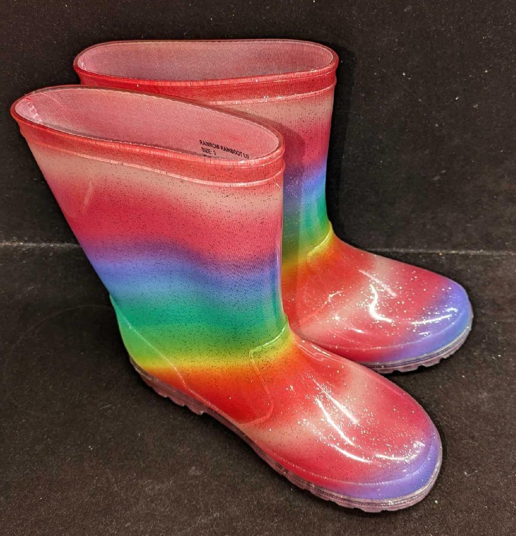 Children's Size 3 PVC Rainbow Boots: Children's Size 3 PVC Rainbow Boots. The maker and date of creation is unknown. Each boot is approx 9 1/2" x 3 3/8" x 8 3/4". The total weight is 1.75lb. There is some light wear on the outsoles.