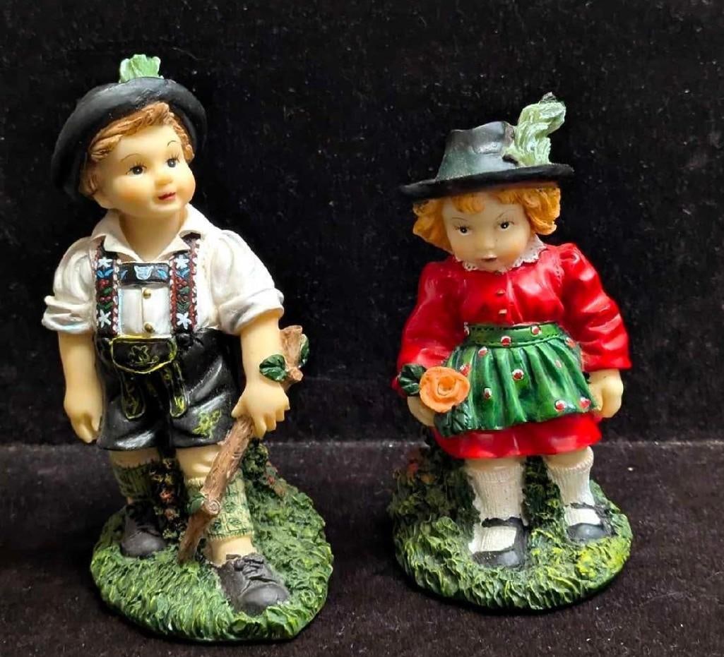 Vintage Resin Boy And Girl Bavarian German Dress Figurines: Vintage Resin Boy And Girl Bavarian German Dress Figurines. The maker and date of creation is unknown and the figurines are unmarked on the bottom. The boy is approx 4 5/8" x 2 1/4" x 2 1/2" and the g