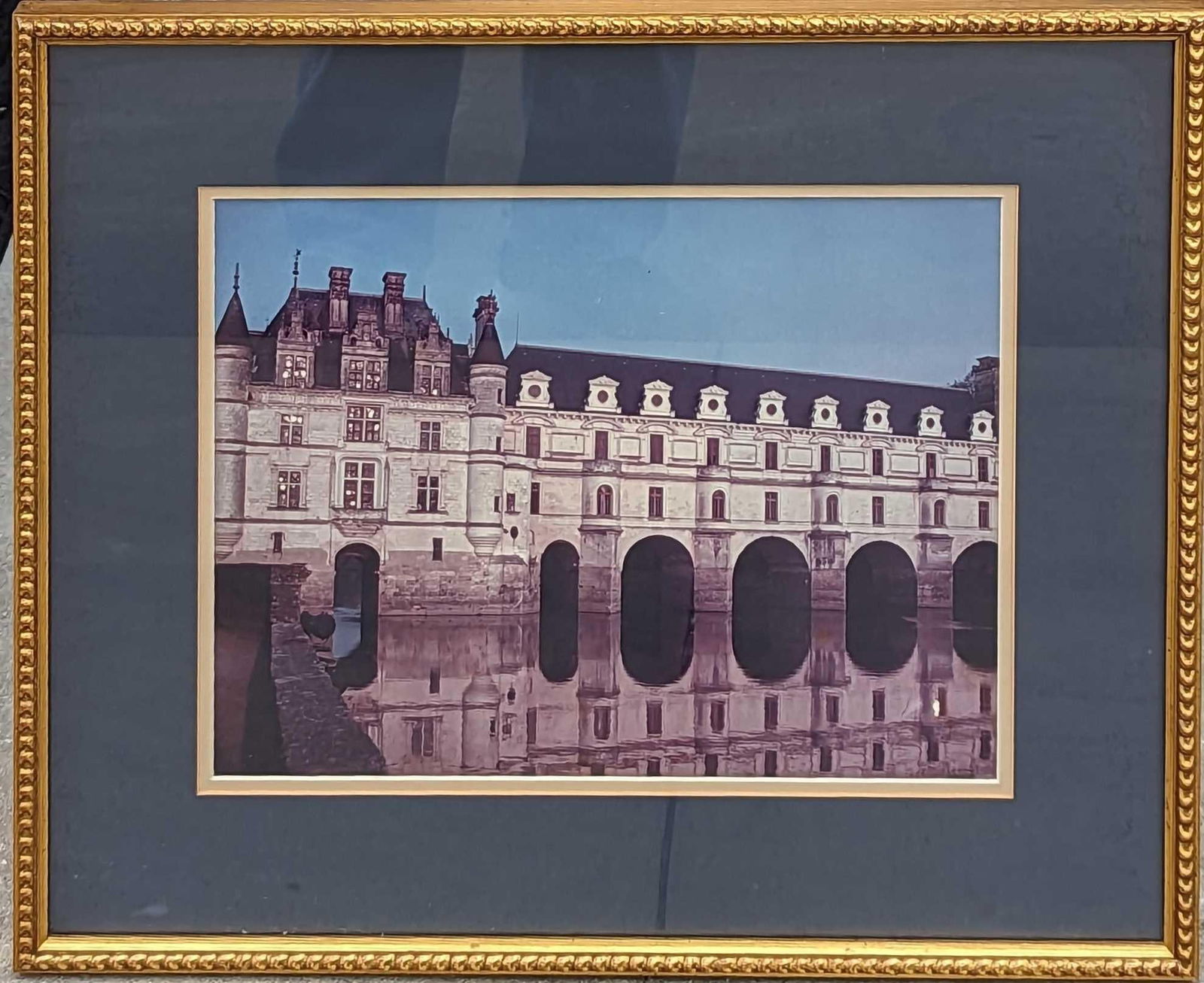 Framed Chateau de Chenonceau Photo: Framed Chateau de Chenonceau Photo. The photographer did not sign the photo. The framed print is approximately 20 1/2" x 1" x 17 1/4" and it weighs 4.10 lbs. There is some wearing on the matting on