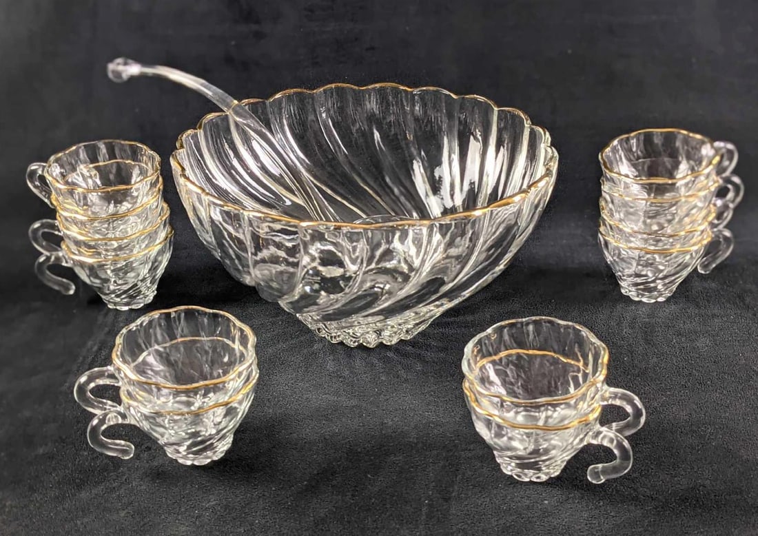 Hazel Atlas Glass Colonial Crystal Swirl Punch Bowl: Retired Hazel Atlas Glass Colonial Crystal Swirl Punch Bowl. The bowl is approx 10 1/2" x 10 1/2" x 6" Comes with 12 punch cups. These are approx 4 1/2" x 3" x 2 1/2". Comes with a serving spoon that