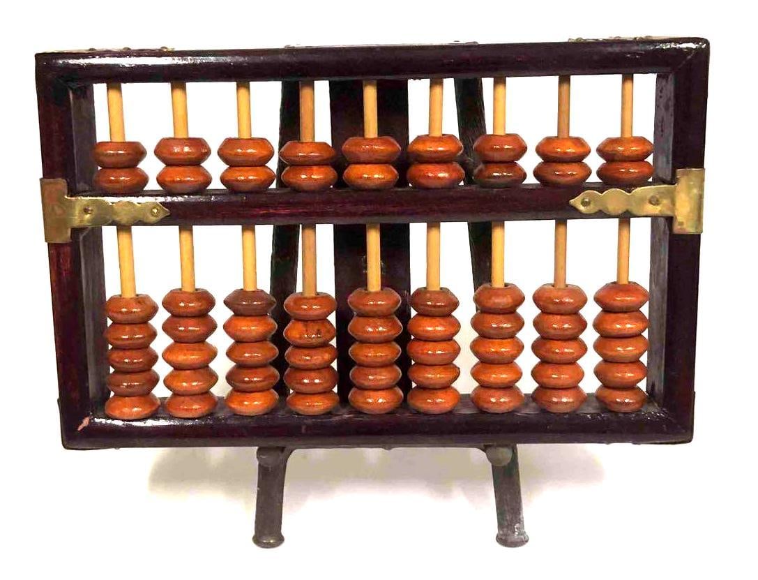 Lotus-Flower Brand 63 Bead Abacus With Stand: This lot contains a Lotus-Flower Brand 63 bead Abacus with stand. This Abacus is made of wood and brass. Made in the Peoples Republic Of China. The stand is approx 3 1/4" x 4" x 5 1/2" while the