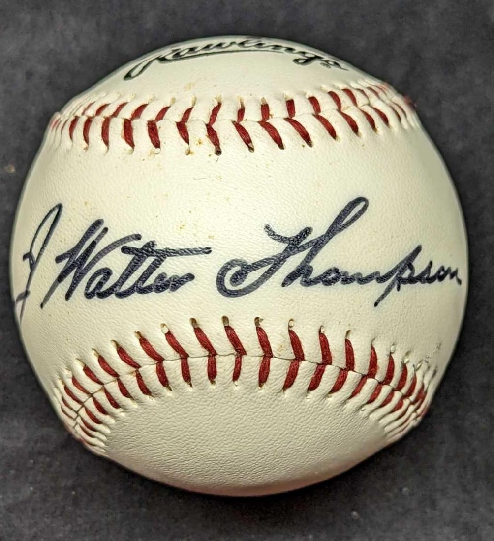 J Walter Thompson Simulated Autographed Baseball: J Walter Thompson Simulated Autographed Baseball. This was a vintage promotional baseball for the advertising agency, J. Walter Thompson. This ball is approx 3" x 3" x 3" and it weighs