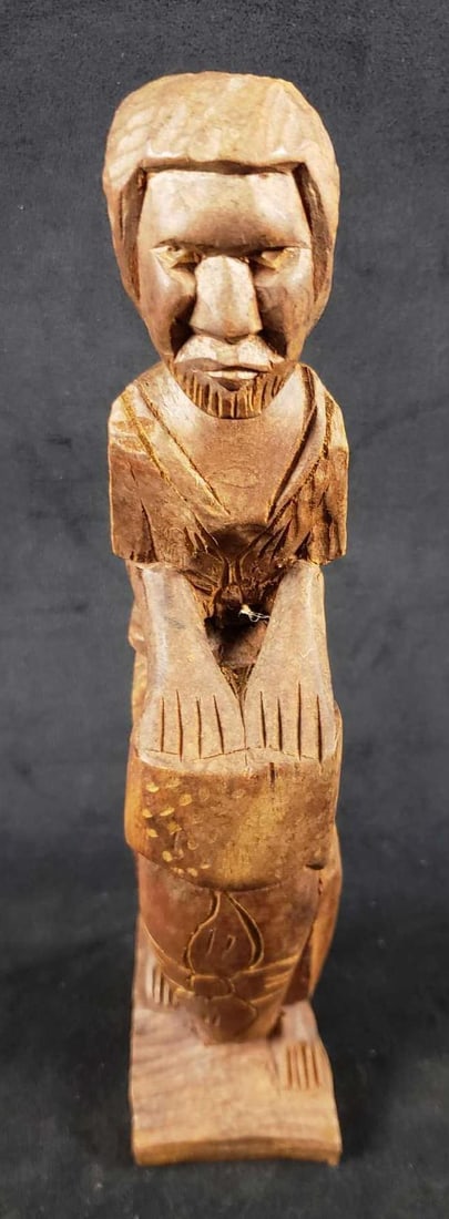 African Wooden Carved Drummer: African Wooden Carved Drummer. This African wooden carved drummer is in great used condition. Aside from dust there are no known damages to the figure. The statue measures 10.5" H x 2.5" W. 