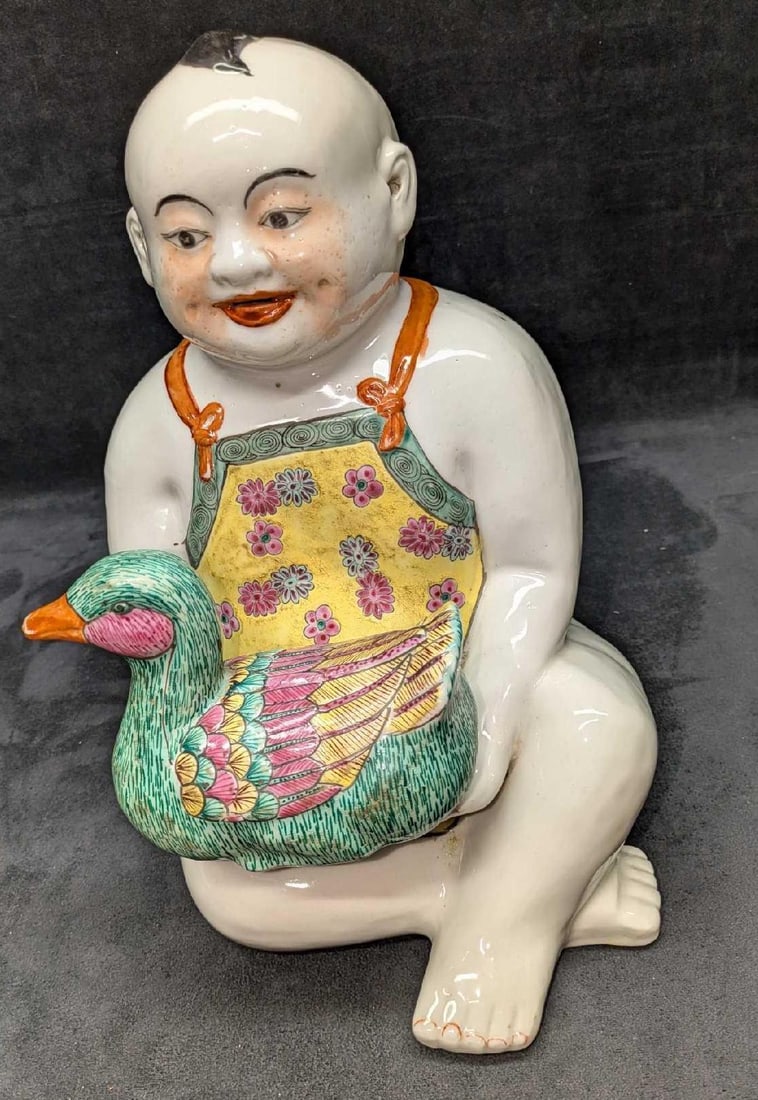 Chinese Famille Rose Porcelain figure Chinese Boy With A Duck R50: Chinese Famille Rose Porcelain figure Chinese Boy With A Duck R50. This is approx 8" x 10" x 12" and it weighs 9.10lbs. There are some light markings and some color loss. Please see the images as they