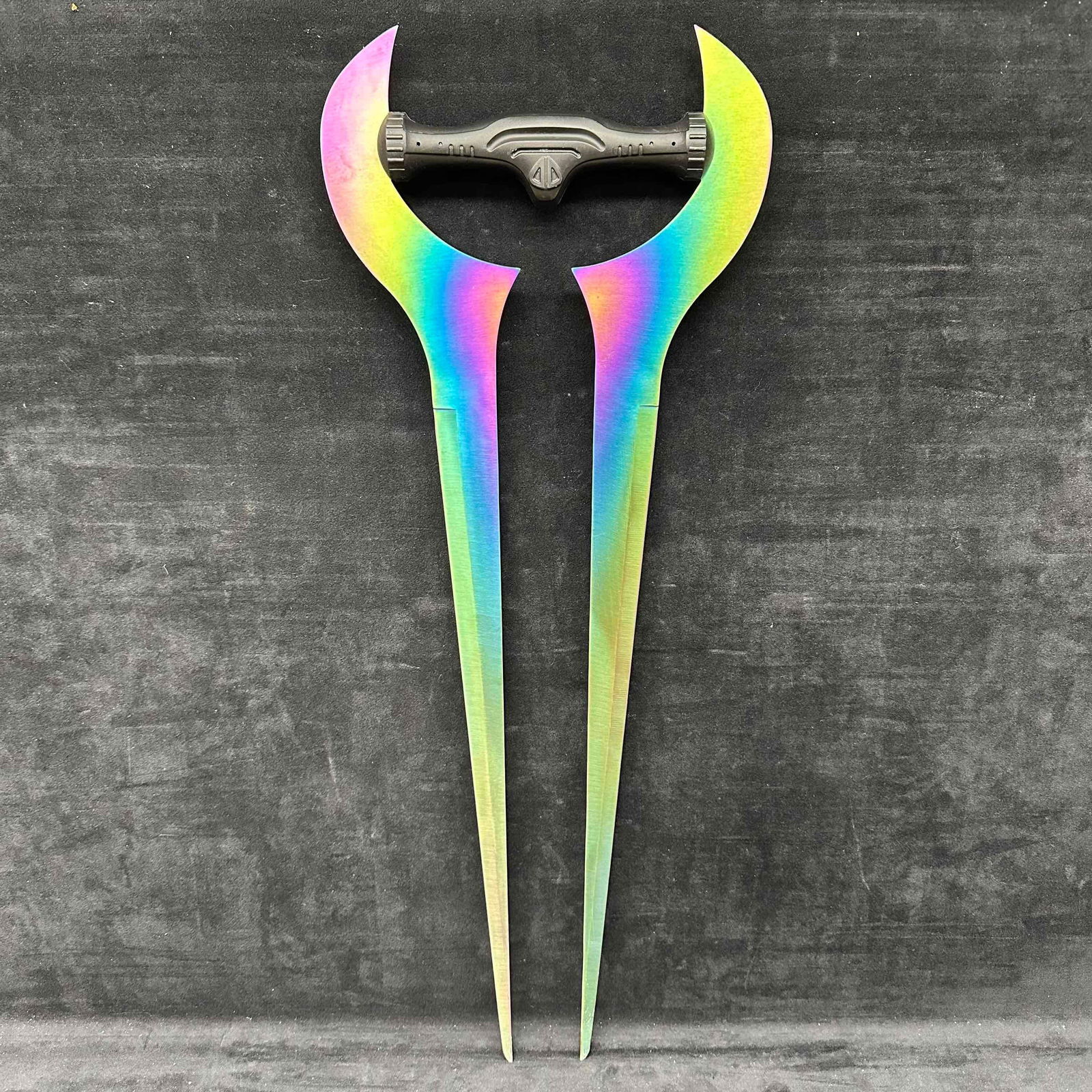 Halo Energy Forked Sword Iridescent Anodized Metal Prop Replica: Marked stainless steel made in china. In good pre-owned condition, minor wear, and light surface scratches. Please reference all photos for full details. Measures: 10" x 27" x 1". Weight: