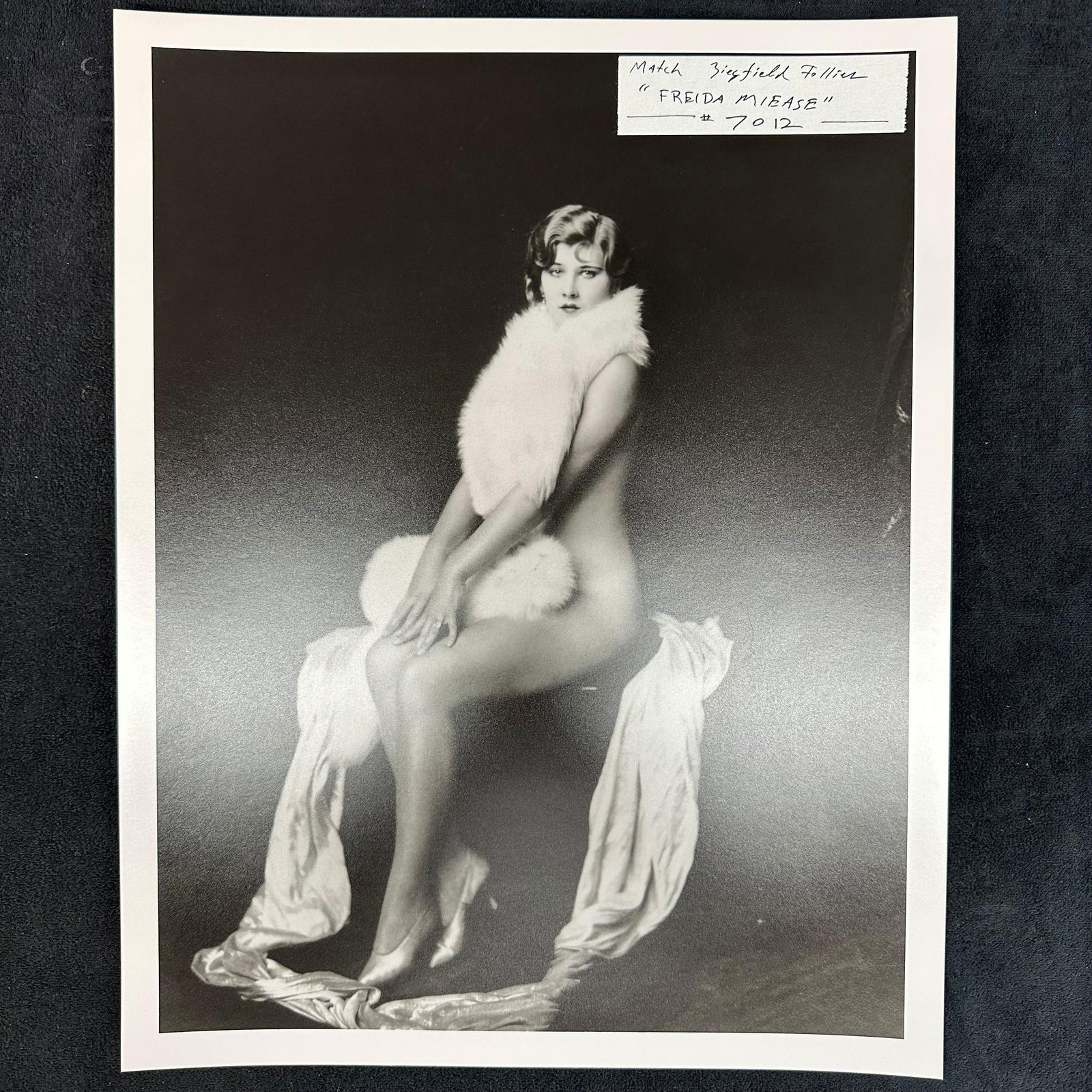 Analog Black and White Photograph Ziegfeld Follies Performer Freida Miese Nude Portrait: Vintage analog photo print depicting Ziegfeld Follies performer Freida Miese in a classic glamour pose. The image shows her seated and draped in a fur stole, with a graceful styling characteristic of