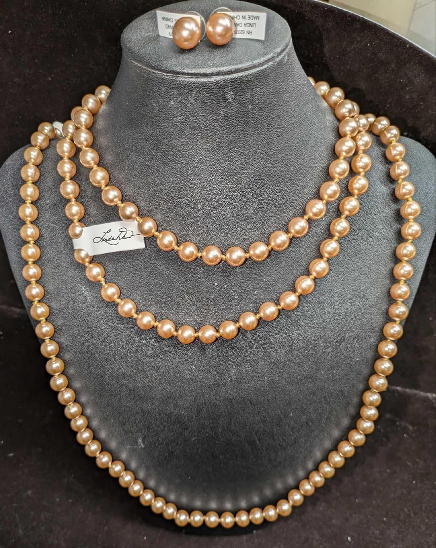 2 Linda Dano Long Faux Pearl Necklaces And Earring Set: 2 Linda Dano Long Faux Pearl Necklaces And Earring Set. The necklaces are approx 36" and the earrings are approx 3/8" x 1" x 3/8". All come in a bag that is approx 2 1/2" x 1"