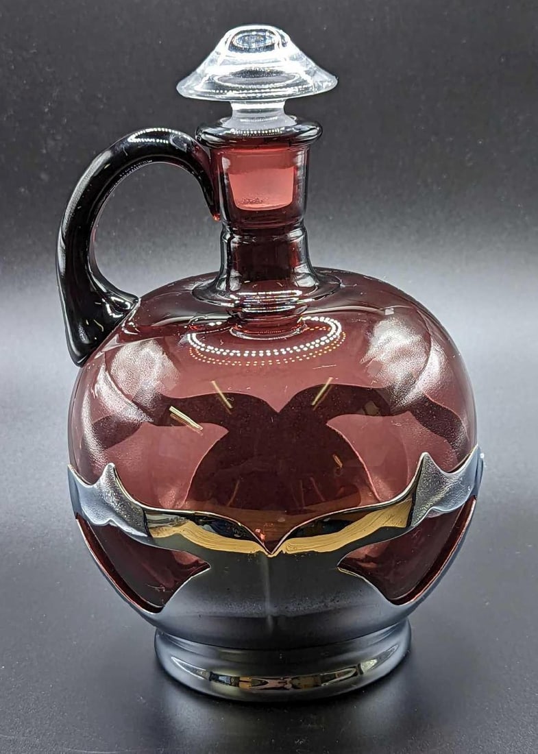 Vintage Farber Bros. Amethyst Chrome Decanter JB: Vintage Farber Bros. Amethyst Chrome Decanter JB. This is approx 5 1/2" x 5 1/2" x 8" and it weighs 1.48lb. There is some scratches and markings on the chrome. There is a small chip on the top.