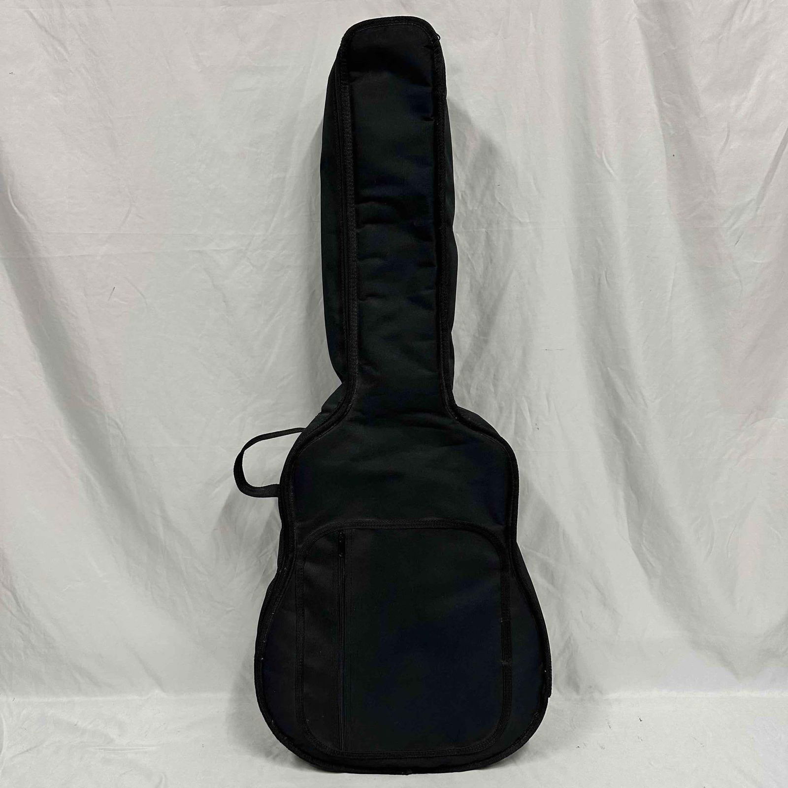 Takamine G230 Acoustic Guitar with Soft Case: Takamine G230 acoustic guitar made in Korea. Natural wood finish with black pick guard. Comes with a padded black soft case. The guitar shows signs of use with a notable crack and wear on the side bod