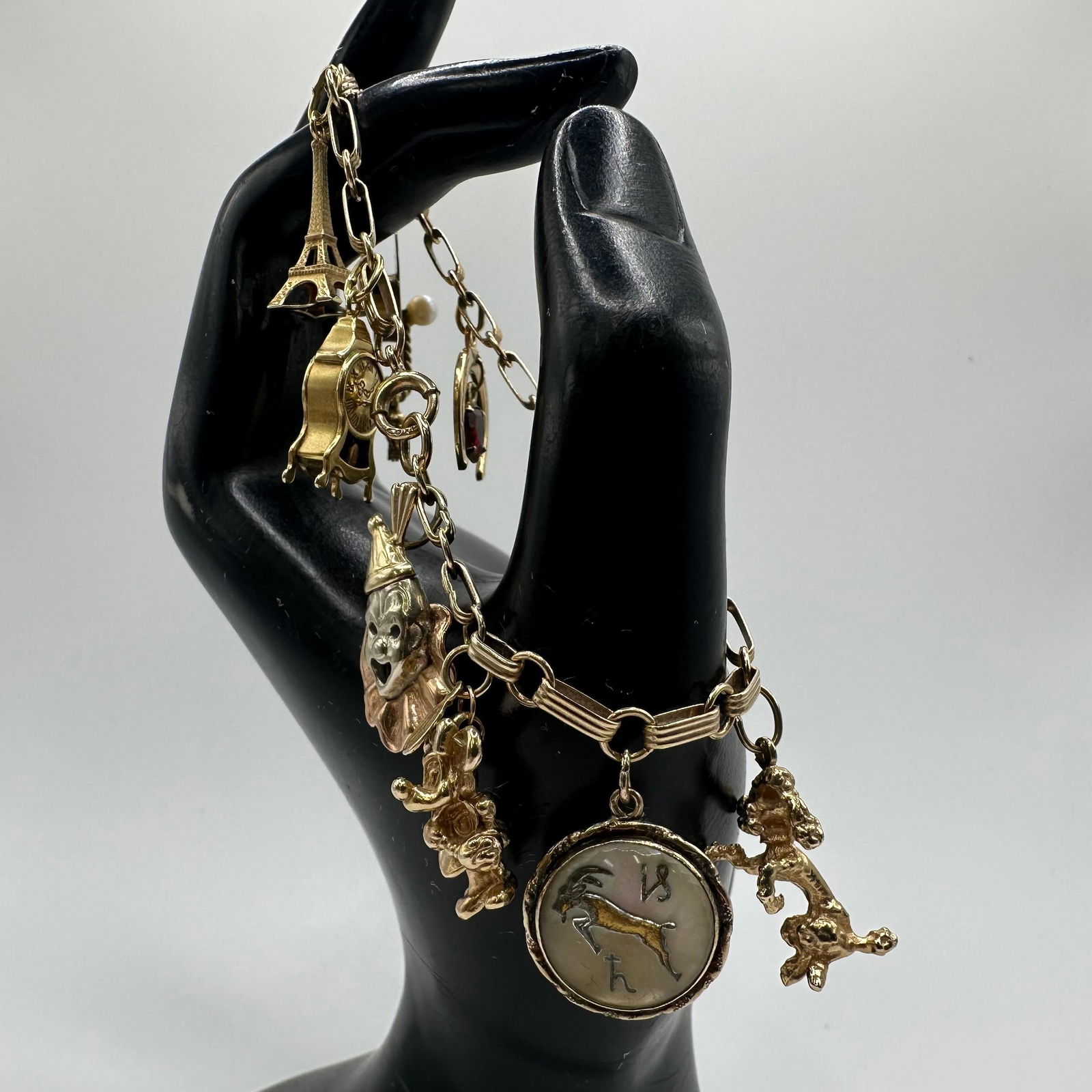 14K Gold Charm Bracelet Clown Disney Clock Heart Grad Cap Theme: This item is in good pre-owned, previously used/displayed condition with noticeable light wear and surface scratches. Please reference all photos for full details. This piece of jewelry has been teste