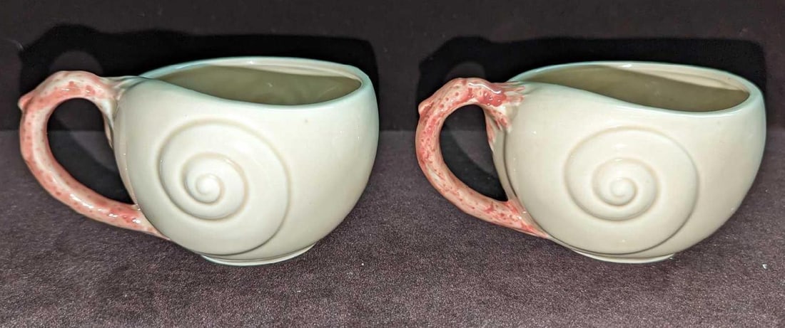 2 Vintage Retired Fitz & Floyd Oceana Flat Cups H K57: 2 Vintage Retired Fitz & Floyd Oceana Flat Cups H K57. This retired series was originally released in 1977. Each cup is approximately 5" x 4" x 2 1/2" and the total weight is 0.59lb. The cups have no